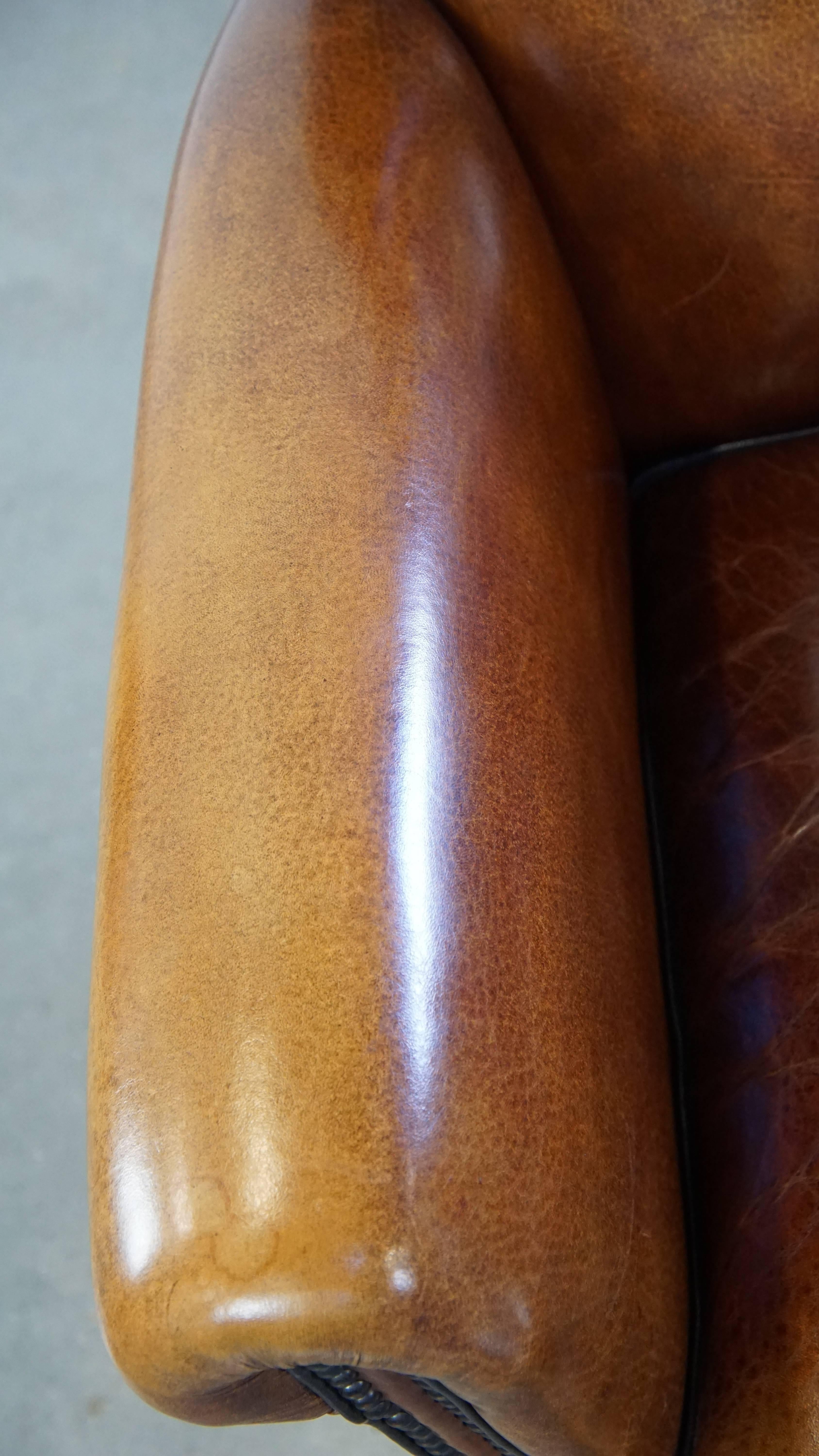 Sheep leather design armchair finished with decorative nails and black piping For Sale 1