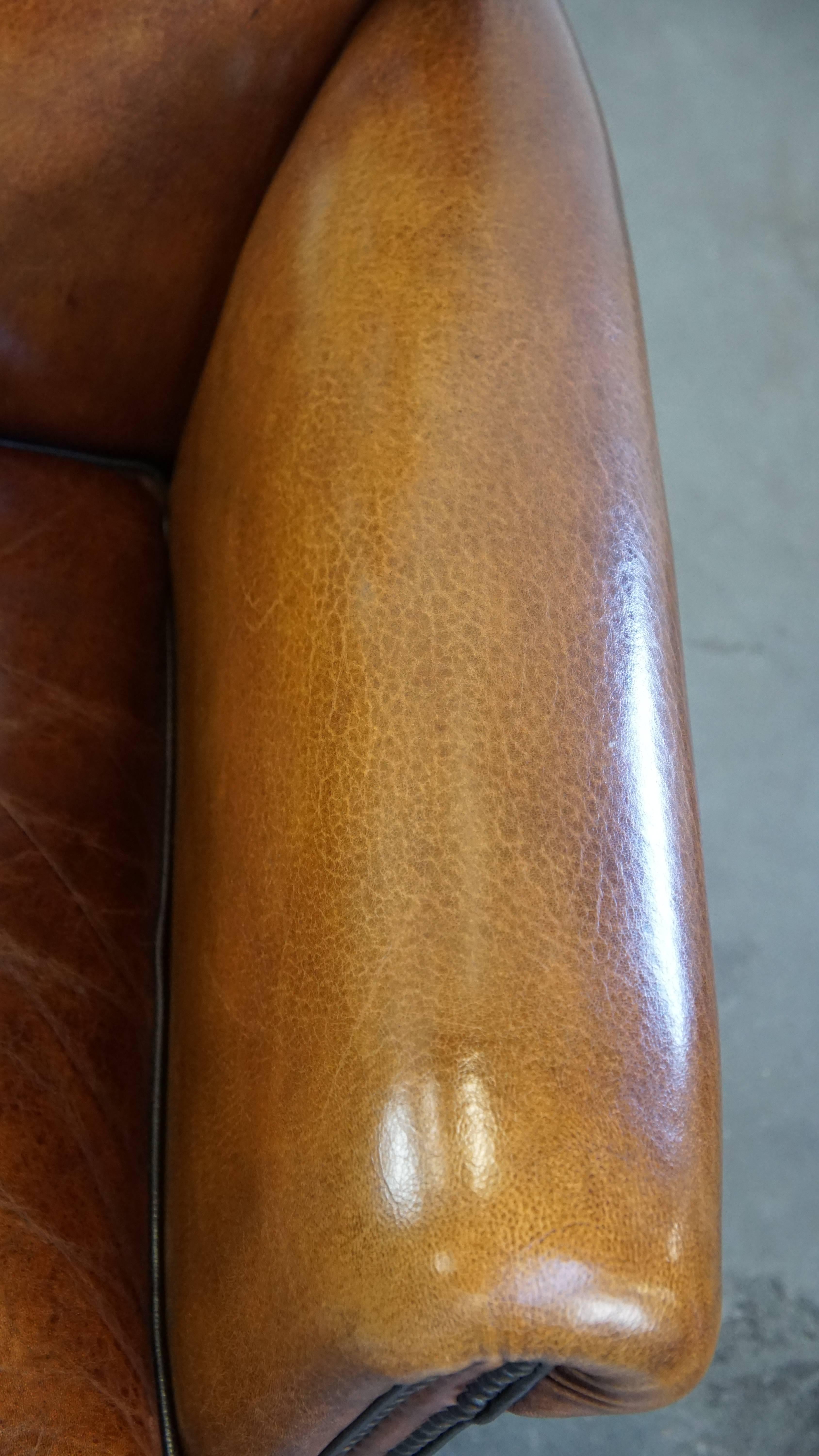 Sheep leather design armchair finished with decorative nails and black piping For Sale 2