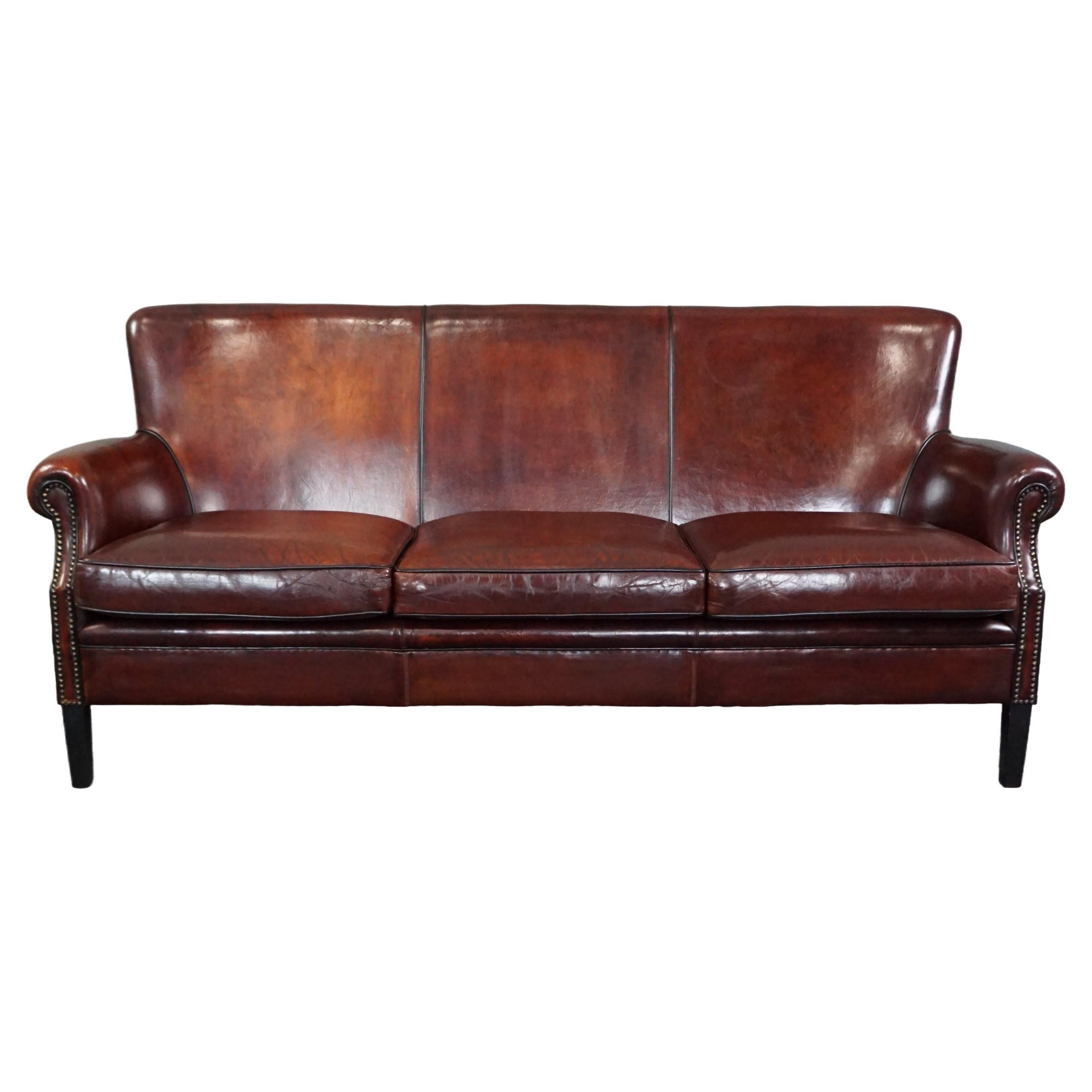 Sheep leather sofa finished with black piping, 3 seater For Sale