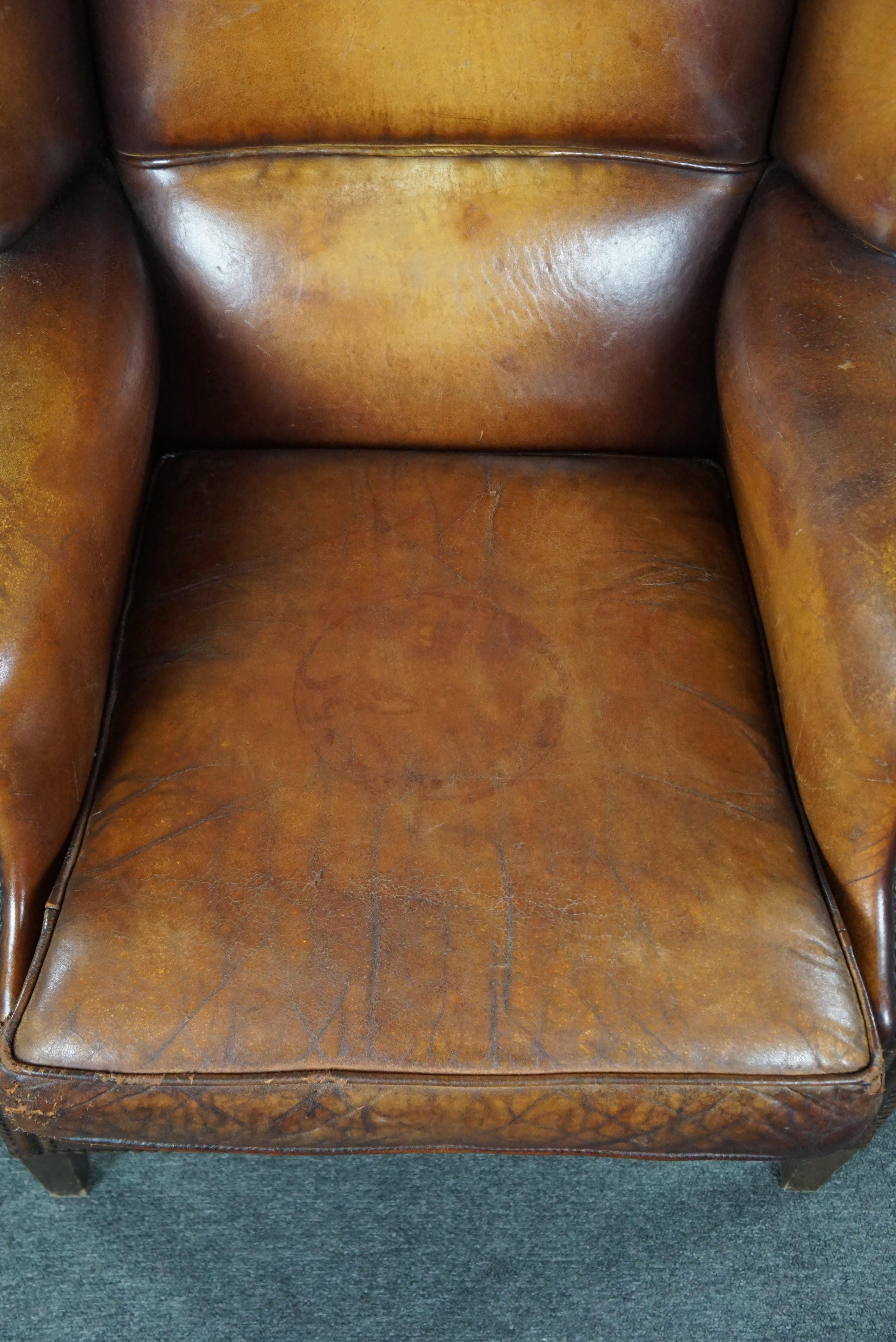 Sheep leather wingback chair with a beautiful patina For Sale 1