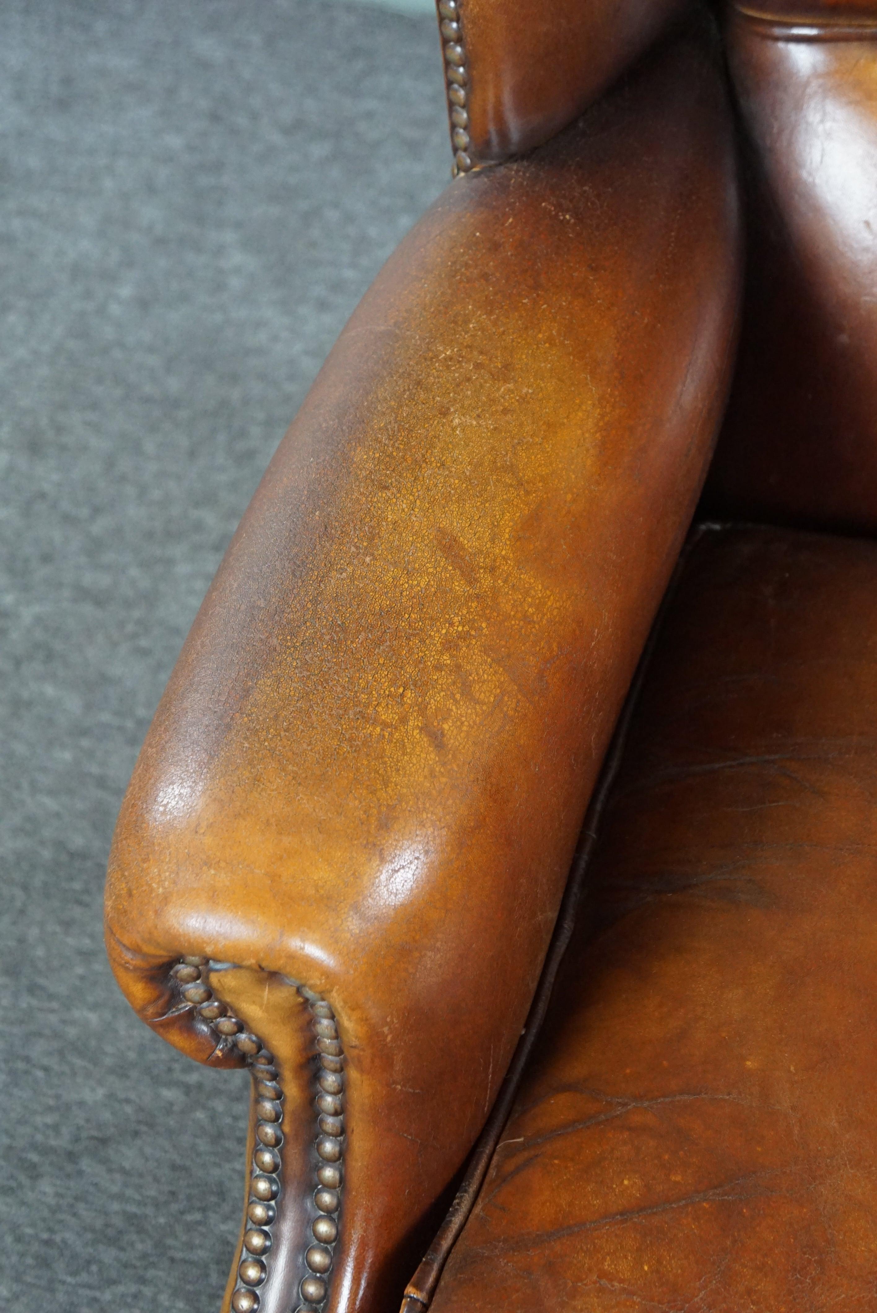 Sheep leather wingback chair with a beautiful patina For Sale 2