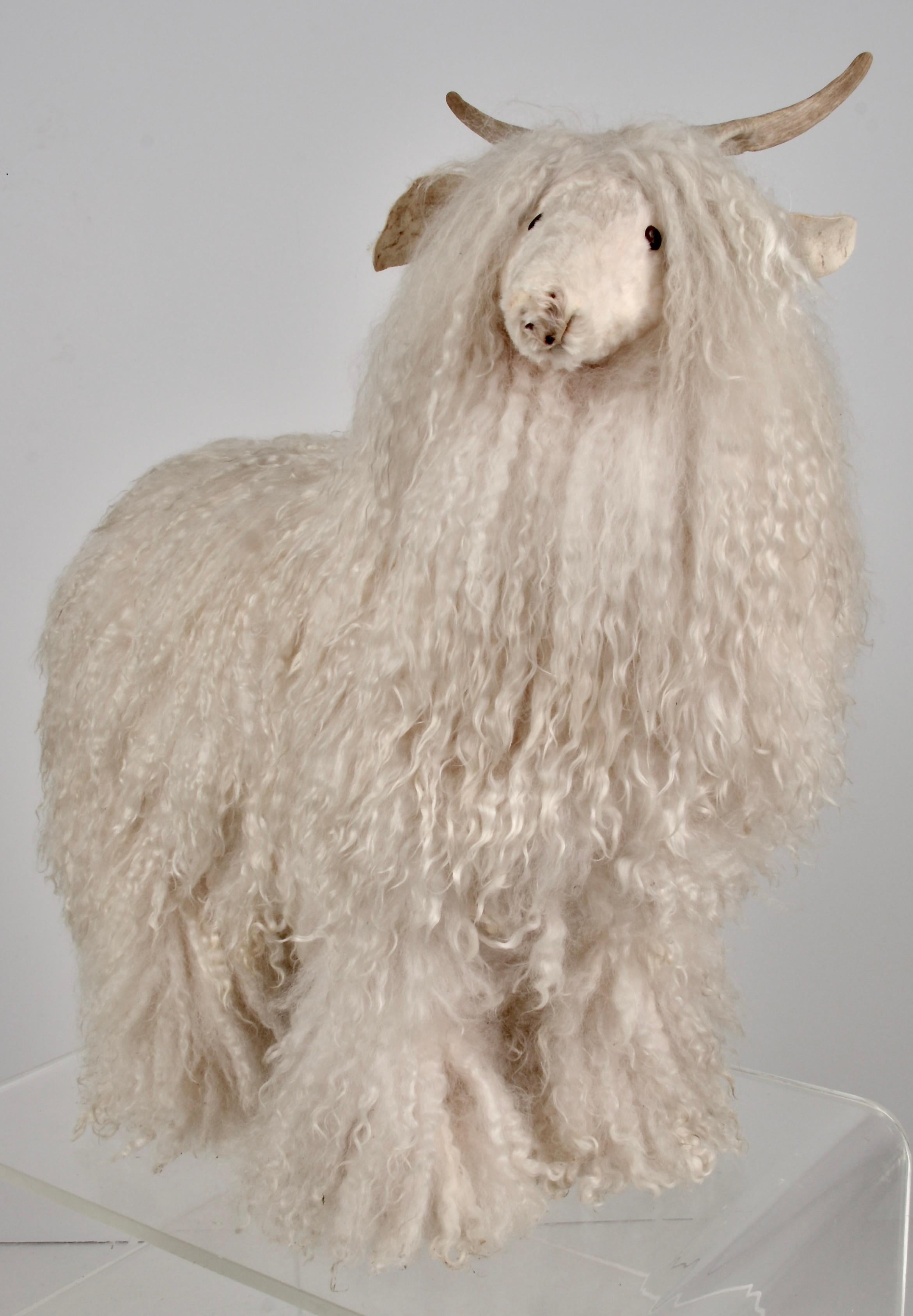 Natural lamb’s wool sheep figure w/ natural horms. Hand crafted by Ray Growler, Navaho whose gallery is located in Four Corners area of New Mexico.  Ray Growler is a popular mixed media artist well know for his animal sculptures crafted using cedar