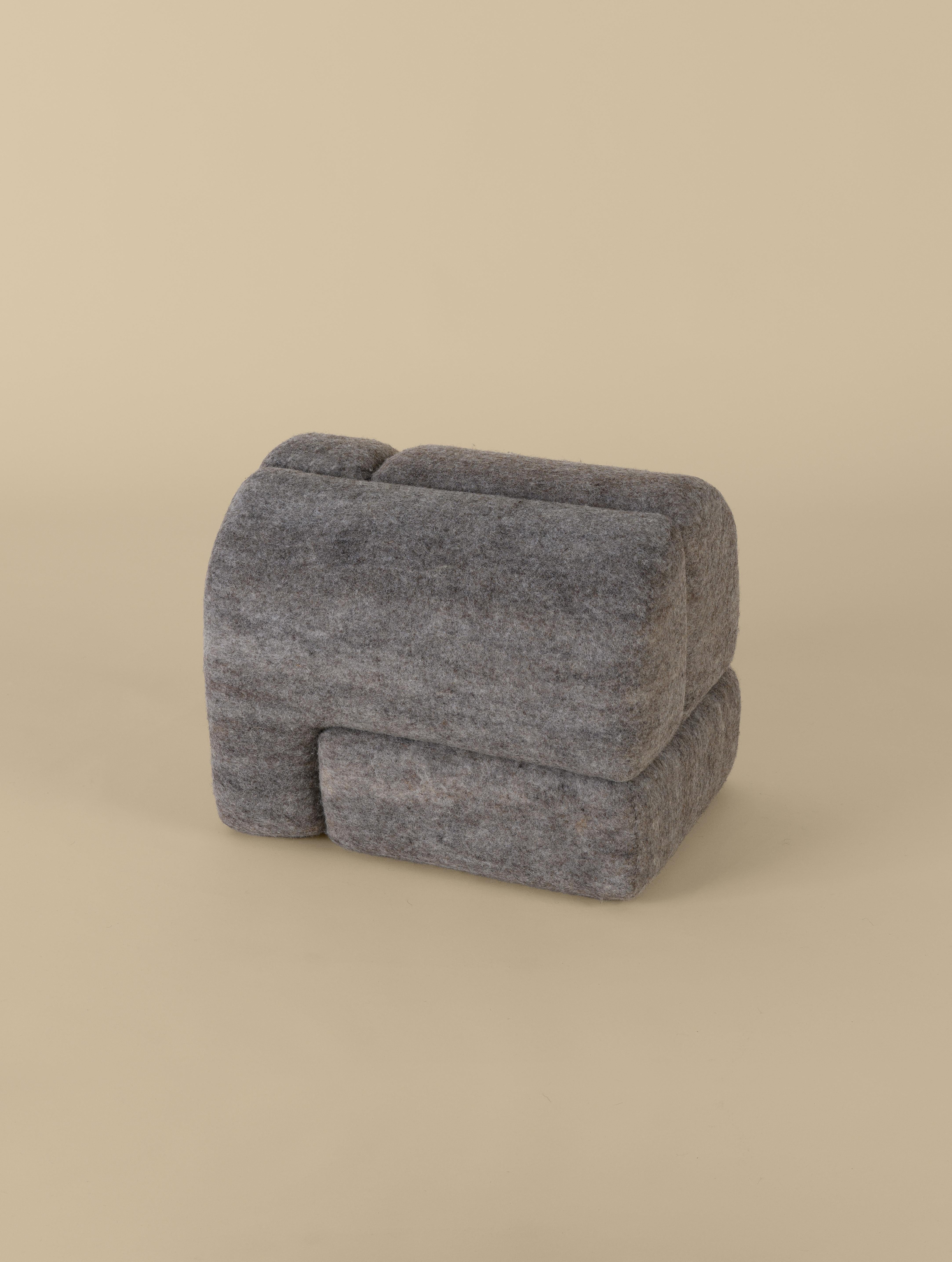 Sheep stool designed by Studio Ahead. The stool is upholstered in custom cream merino wool felt from Northern California sheep 
The stool could be placed on either side horizontally or vertically. Each side design is unique. Designed and fabricated