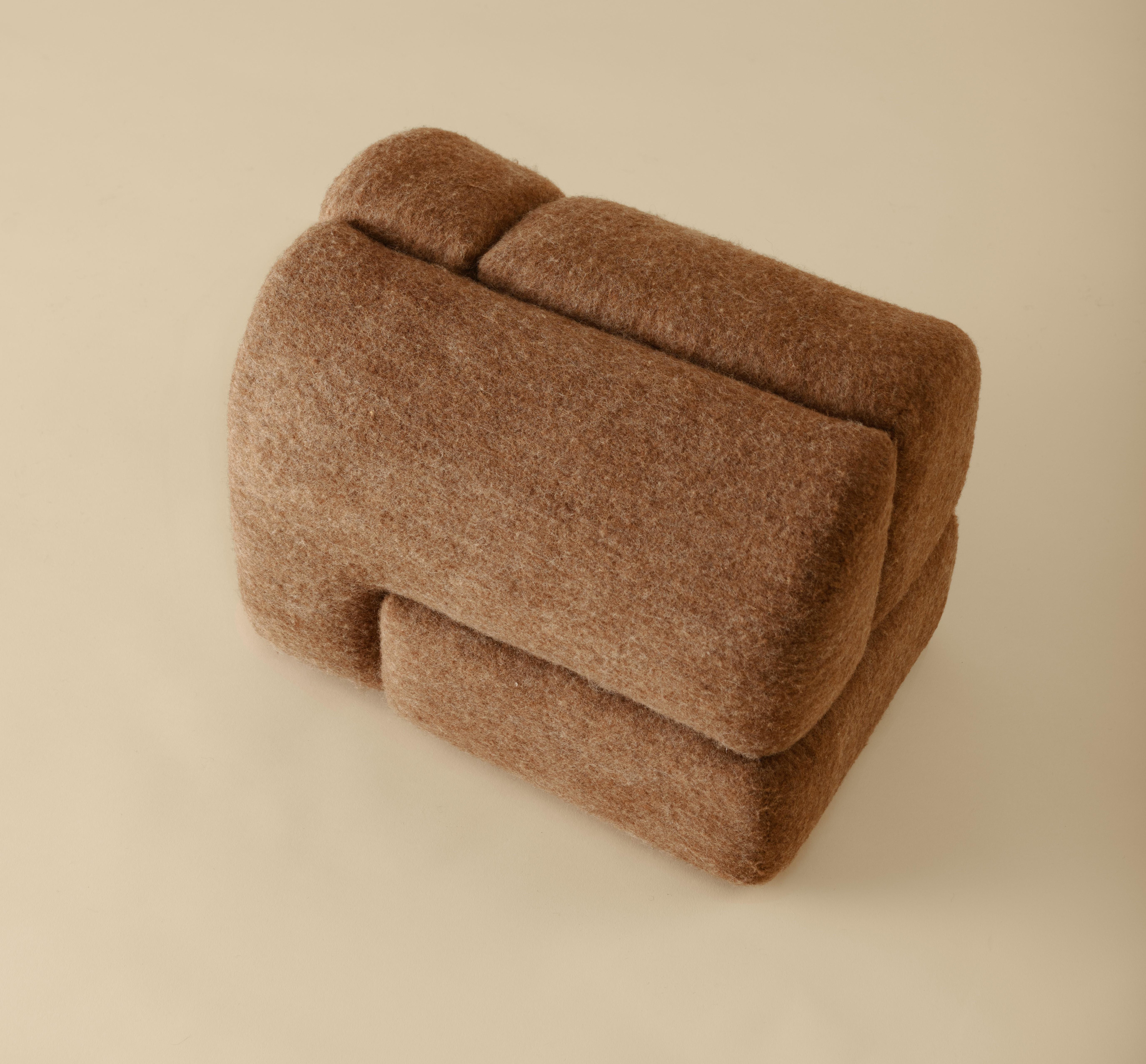 Sheep stool designed by Studio Ahead. The stool is upholstered in custom cream merino wool felt from Northern California sheep 
The stool could be placed on either side horizontally or vertically. Each side design is unique. Designed and fabricated