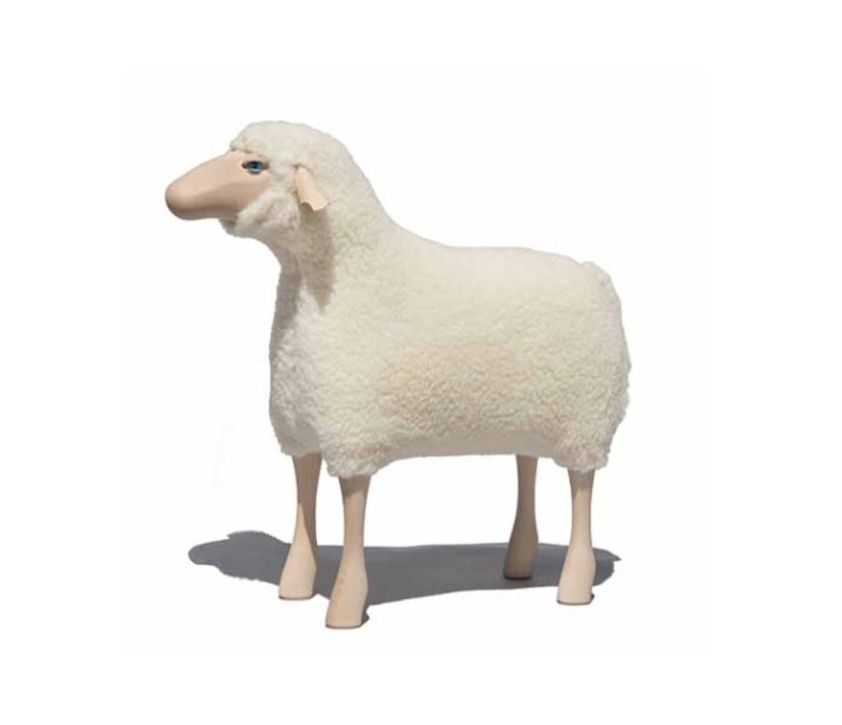 Sheep, white wool plush, beech wood

Created by Hans-Peter KRAFFT in 1982 and handmade in Germany.  This sheep is designed as a piece of furniture and is strong enough to be used as a stool by adults and children.  Materials: Wool, beech, leather