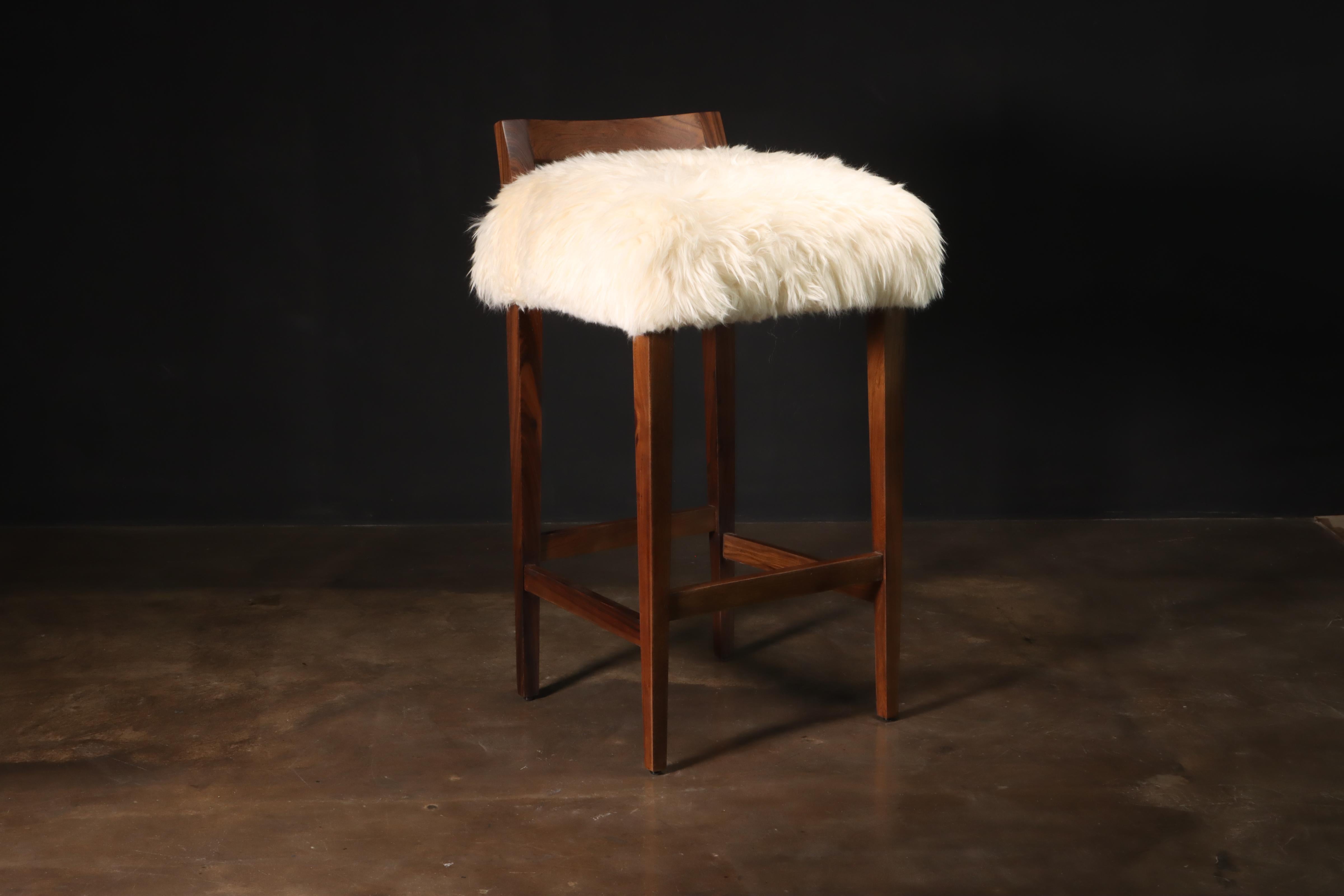 Sheepskin and Exotic Wood Contemporary low back stool from Costantini, Umberto

Measurements are 18” W, 19” D, 36” H, 30” SH as shown.

The Umberto stool is one of Costantini’s original seating designs, featuring a modern, low, carved Argentine