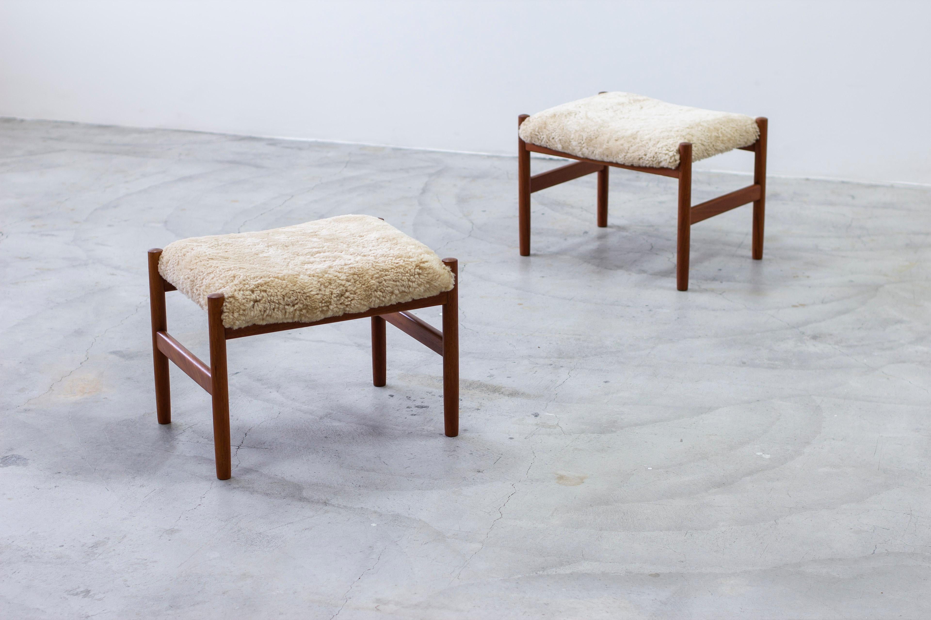 Pair of stools designed by Hugo Frandsen. Produced by Spøttrup in Denmark during the 1960s. Made from solid teak with new sheep skin upholstery. Very good vintage condition with light signs of age related wear and patina.

 

Price for the pair. 

