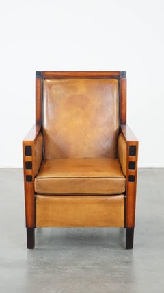Sillón de piel de oveja y madera en buen estado con un bonito diseño Art Déco