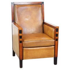 Sheepskin and wooden armchair in good condition with a beautiful Art Deco design