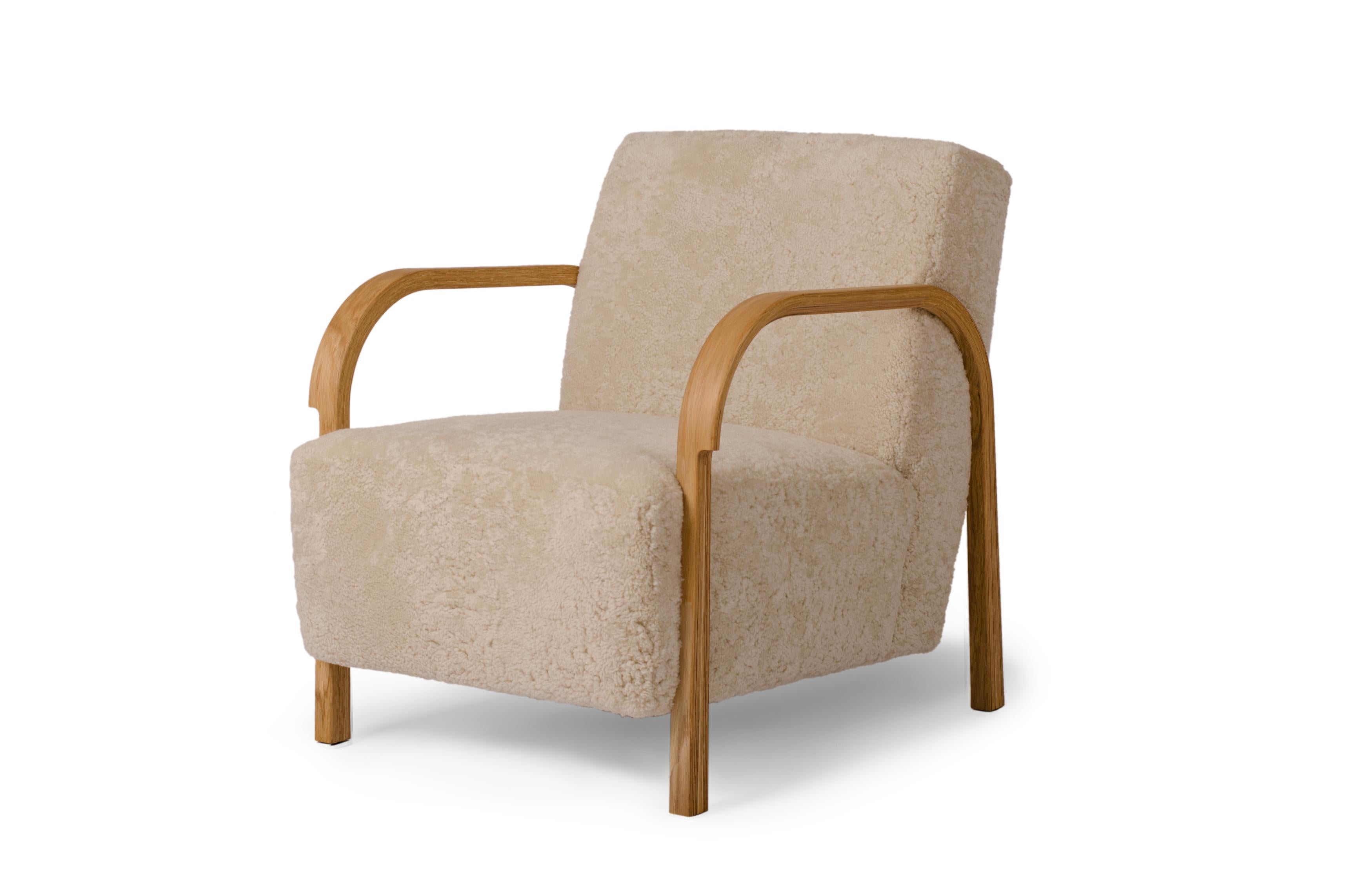 Sheepskin ARCH lounge chair by Mazo Design
Dimensions: W 69 x D 79 x H 76 cm
Materials: Oak, Sheepskin.

With the new ARCH collection, mazo forges new paths with their forward-looking modernism. The series is a tribute to the renowned Danish