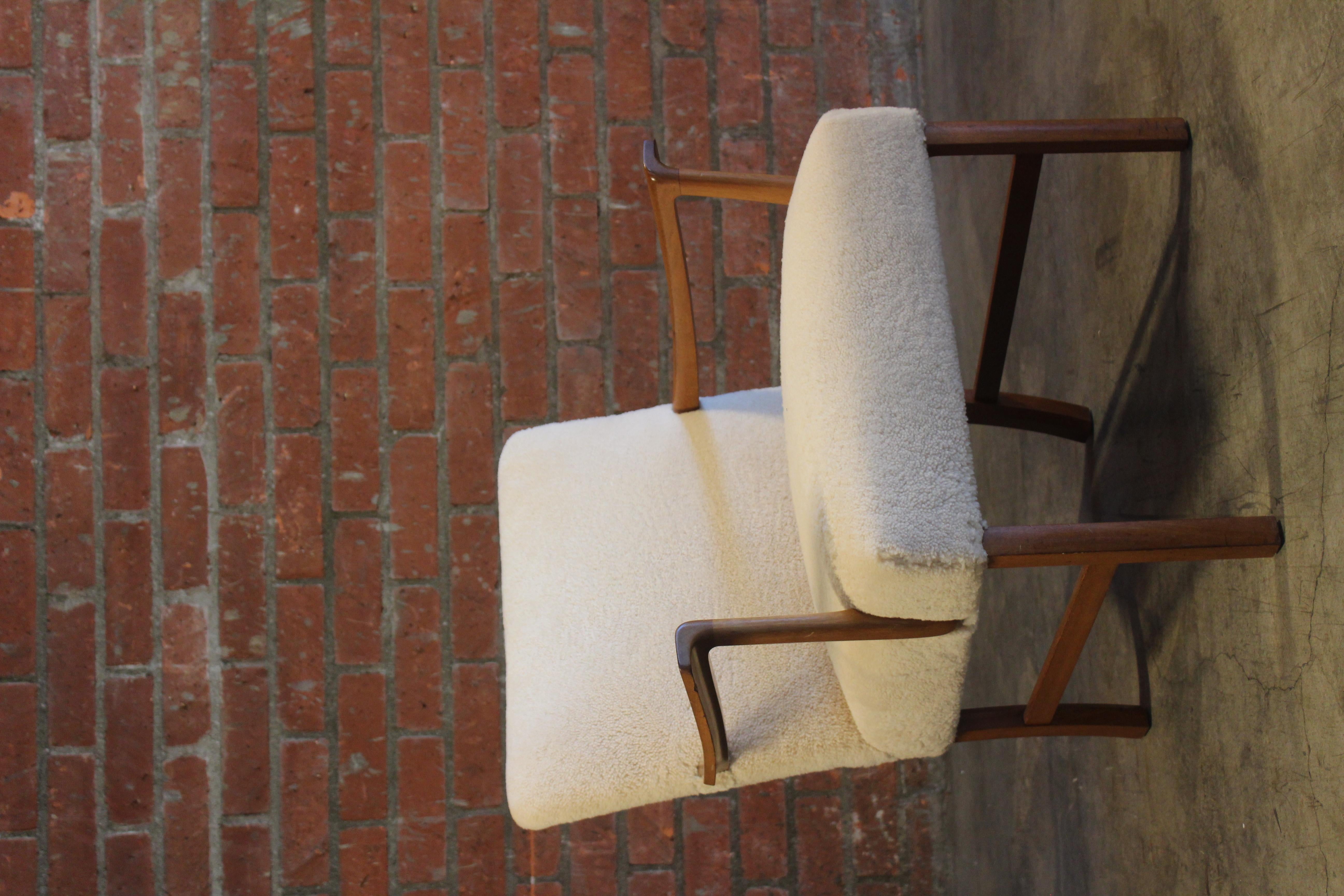 A vintage teak armchair with new sheepskin upholstery by Ole Wanscher for A.J Iversen, Denmark, 1950s. In good condition with minor wear to the frame.