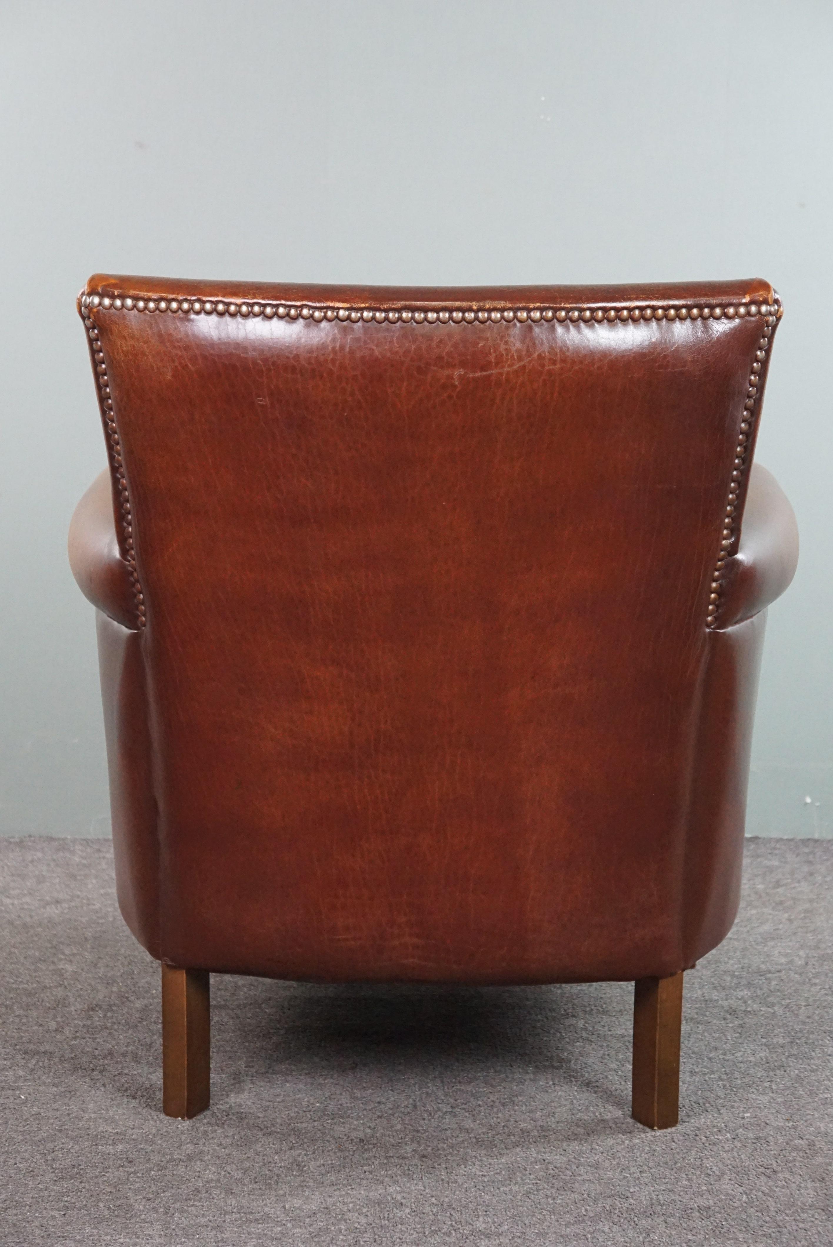 Sheepskin armchair with a wonderful patina and a correct worn look In Fair Condition For Sale In Harderwijk, NL