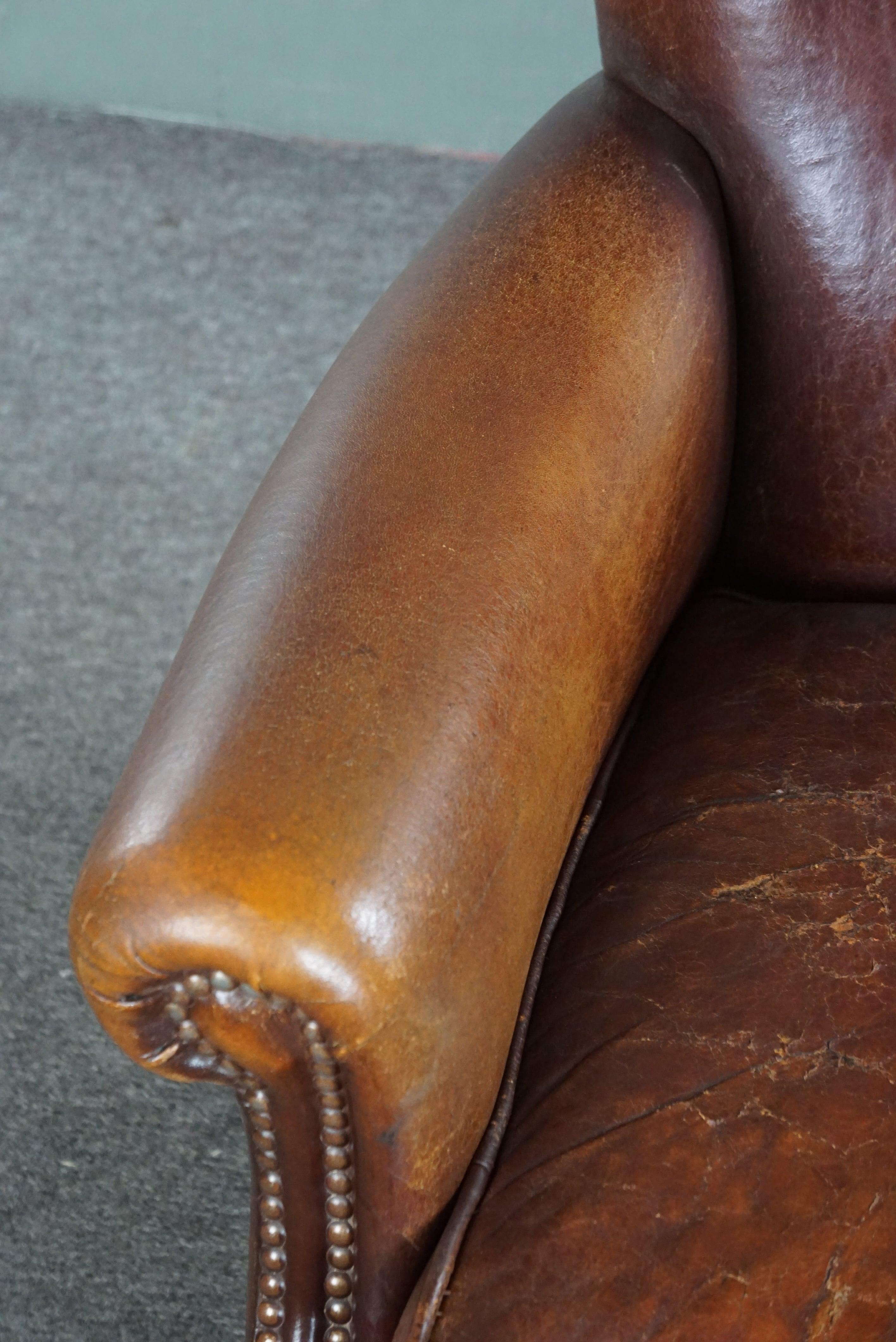 Sheepskin armchair with a wonderful patina and a correct worn look For Sale 1