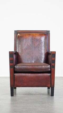 Sheepskin Art Deco design armchair combined with wood and a beautiful patina