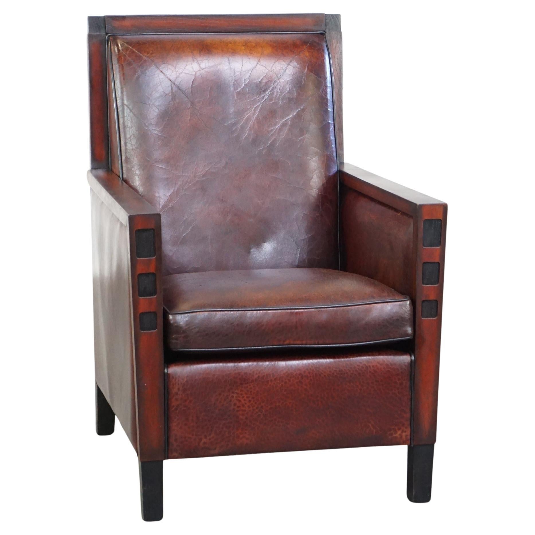 Sheepskin Art Deco design armchair combined with wood and a beautiful patina