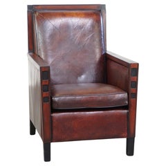 Sheepskin Art Deco design armchair combined with wood and a beautiful patina