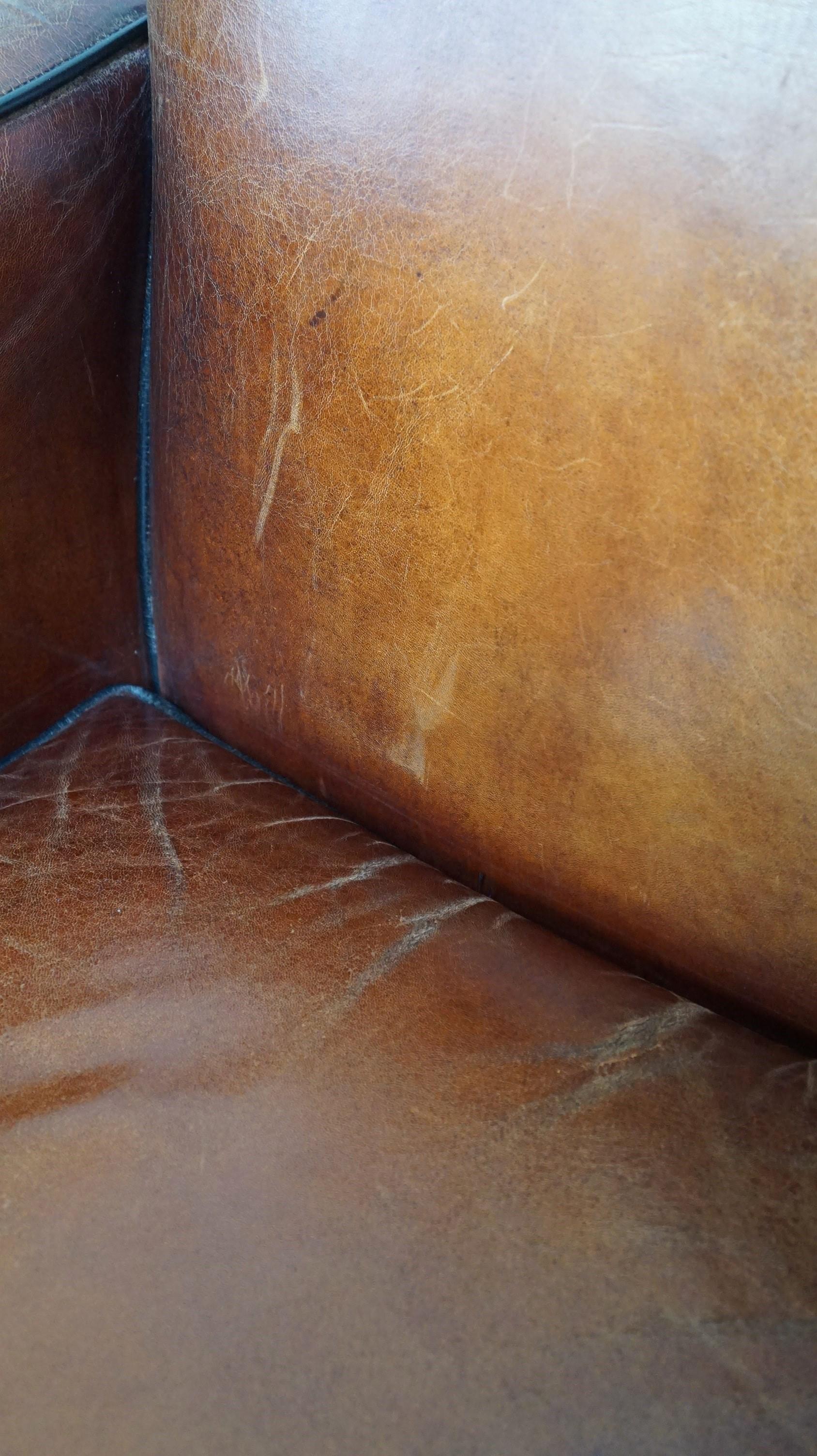 Sheepskin Art Deco design armchair finished with wood and cognac-colored leather For Sale 3