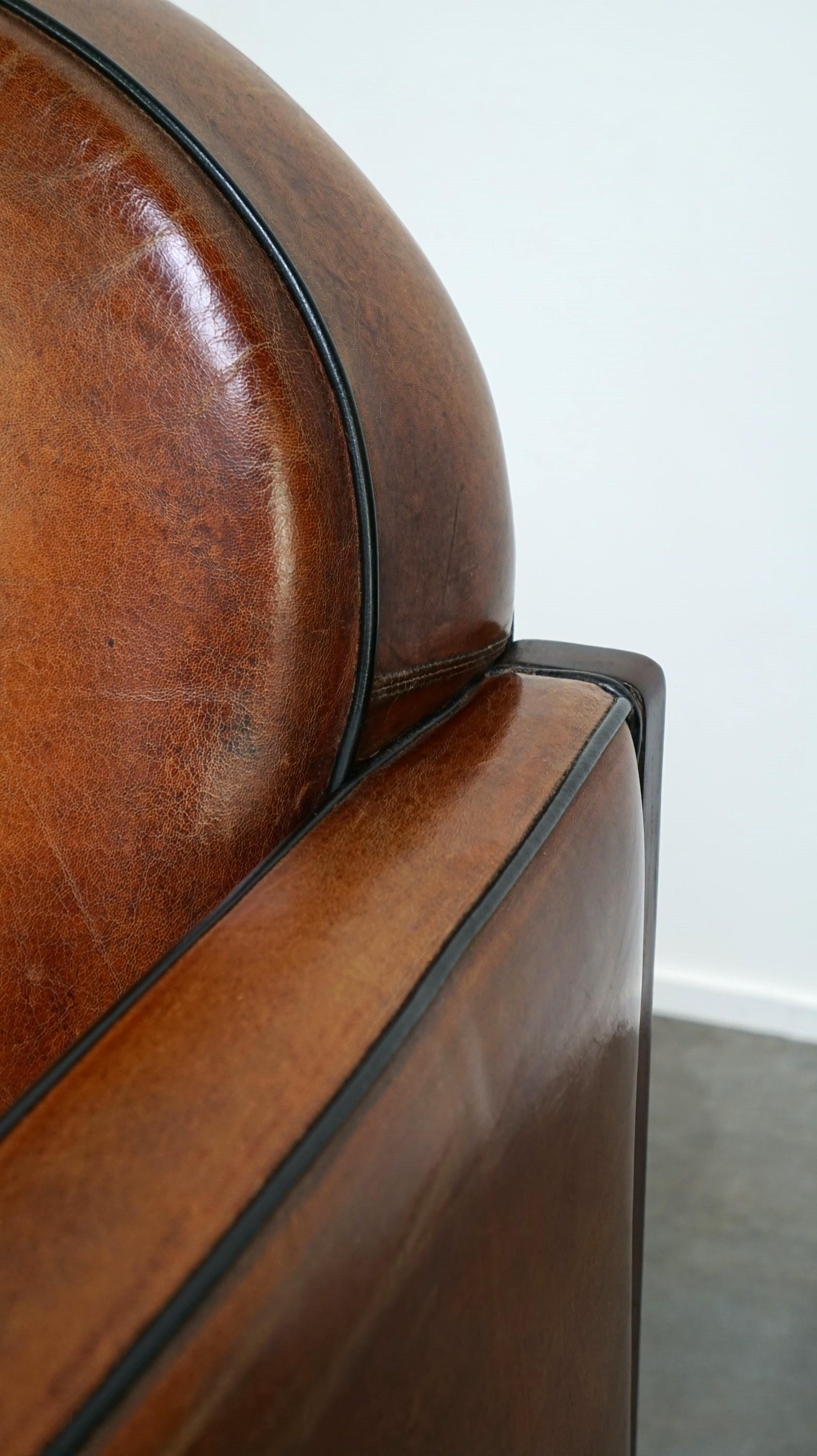Sheepskin Art Deco design armchair finished with wood and cognac-colored leather For Sale 5