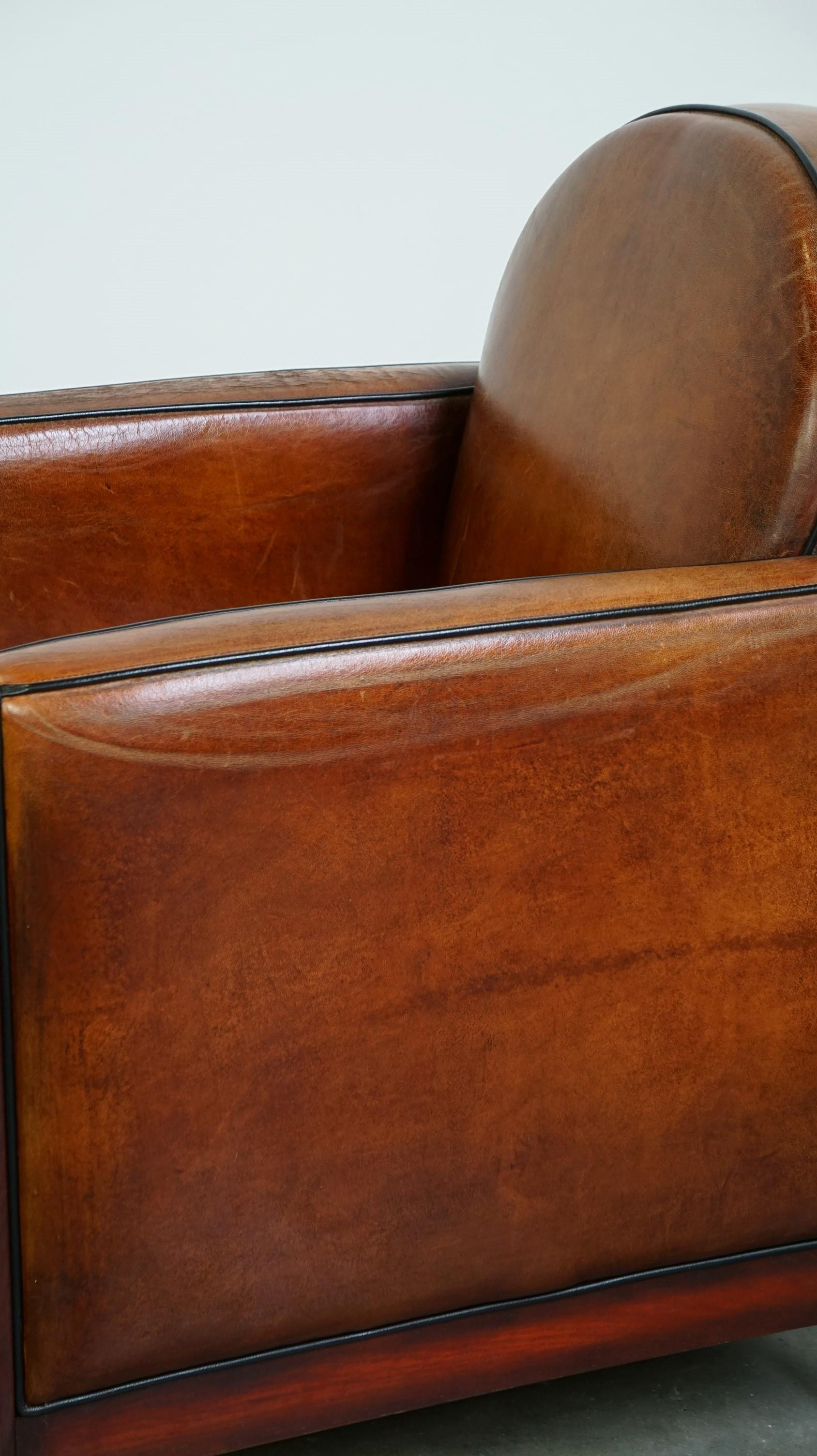 Sheepskin Art Deco design armchair finished with wood and cognac-colored leather For Sale 8
