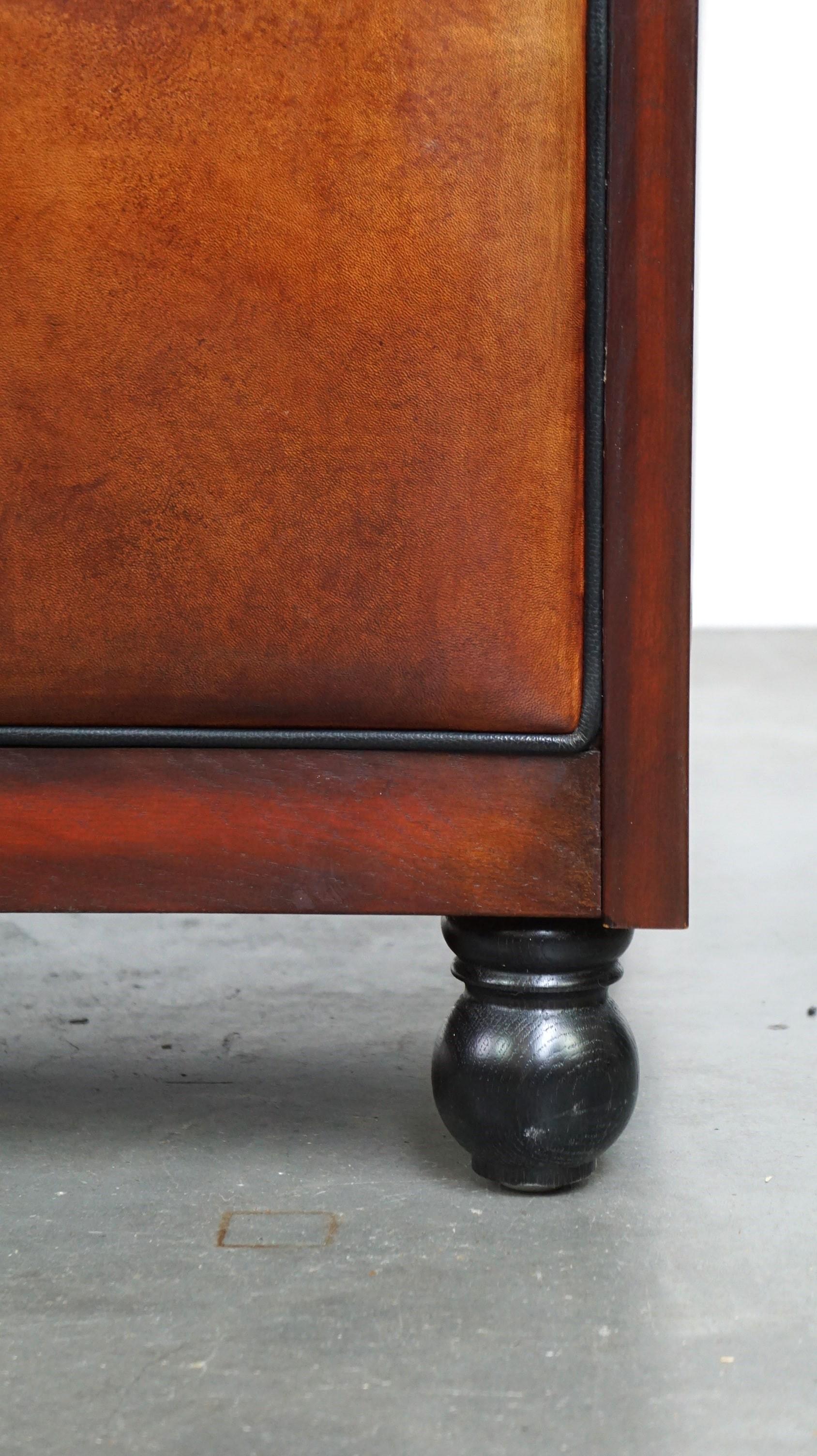 Sheepskin Art Deco design armchair finished with wood and cognac-colored leather For Sale 9