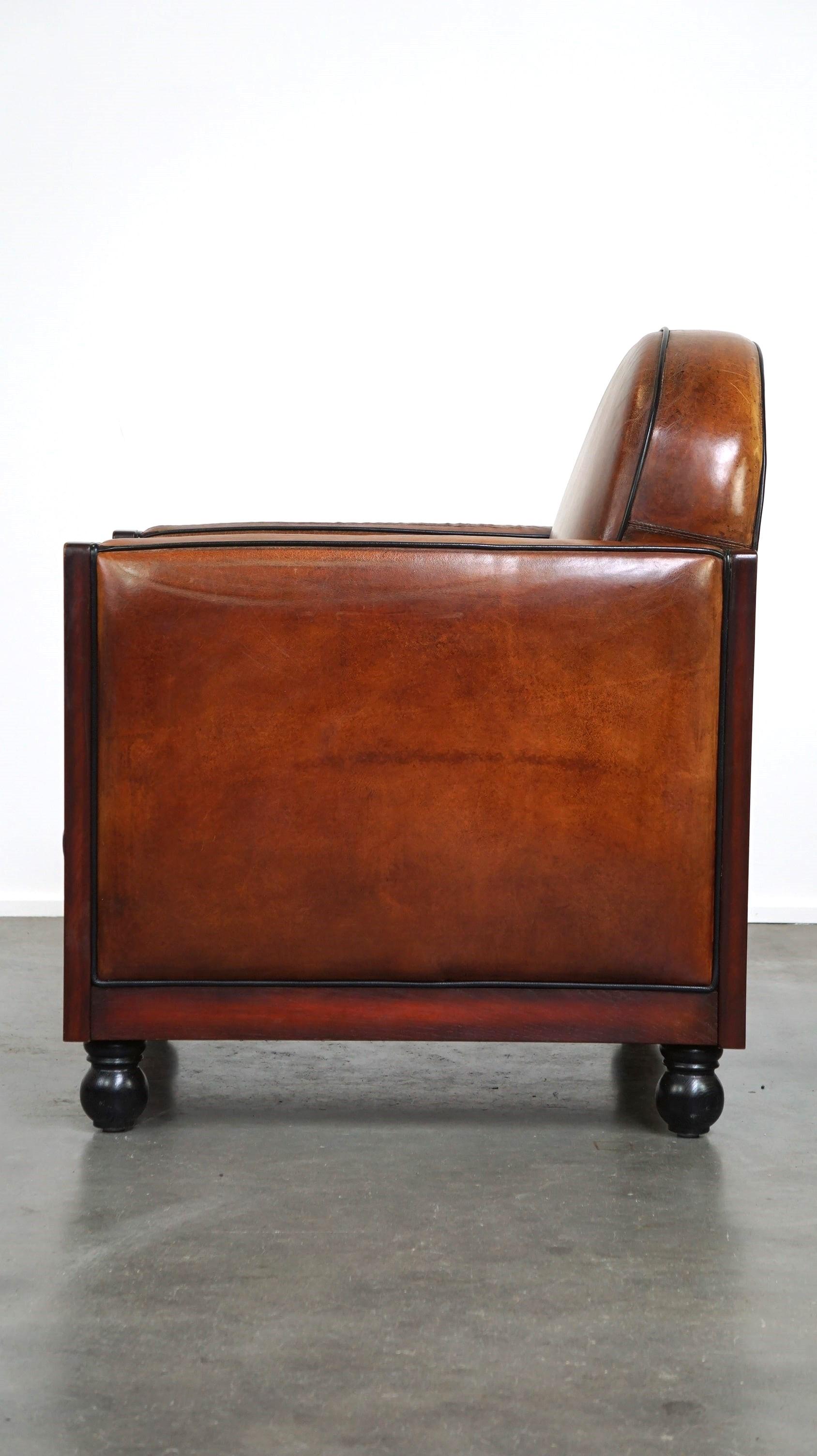 Sheepskin Art Deco design armchair finished with wood and cognac-colored leather In Good Condition For Sale In Harderwijk, NL