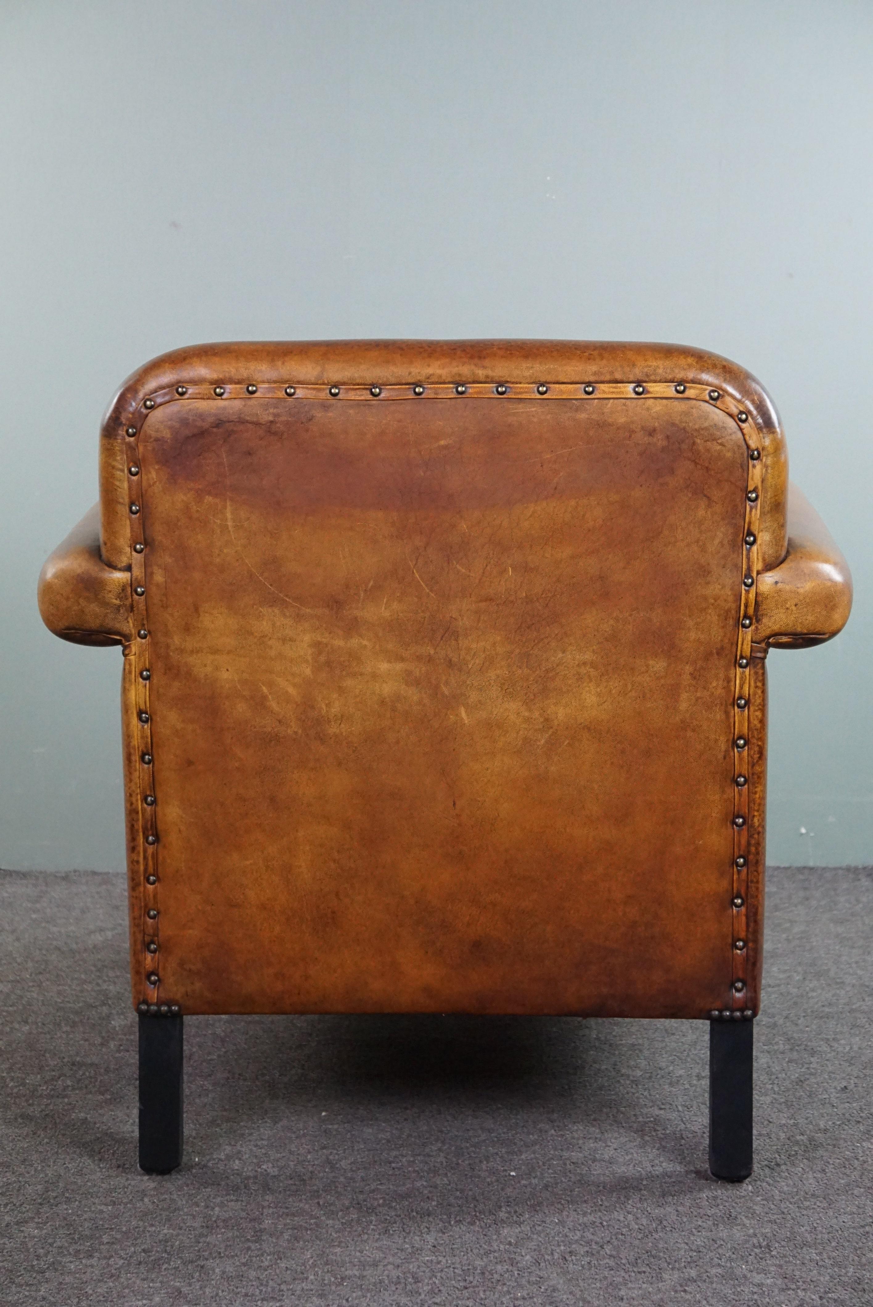 Contemporary Sheepskin Art Deco design armchair with accents all around For Sale