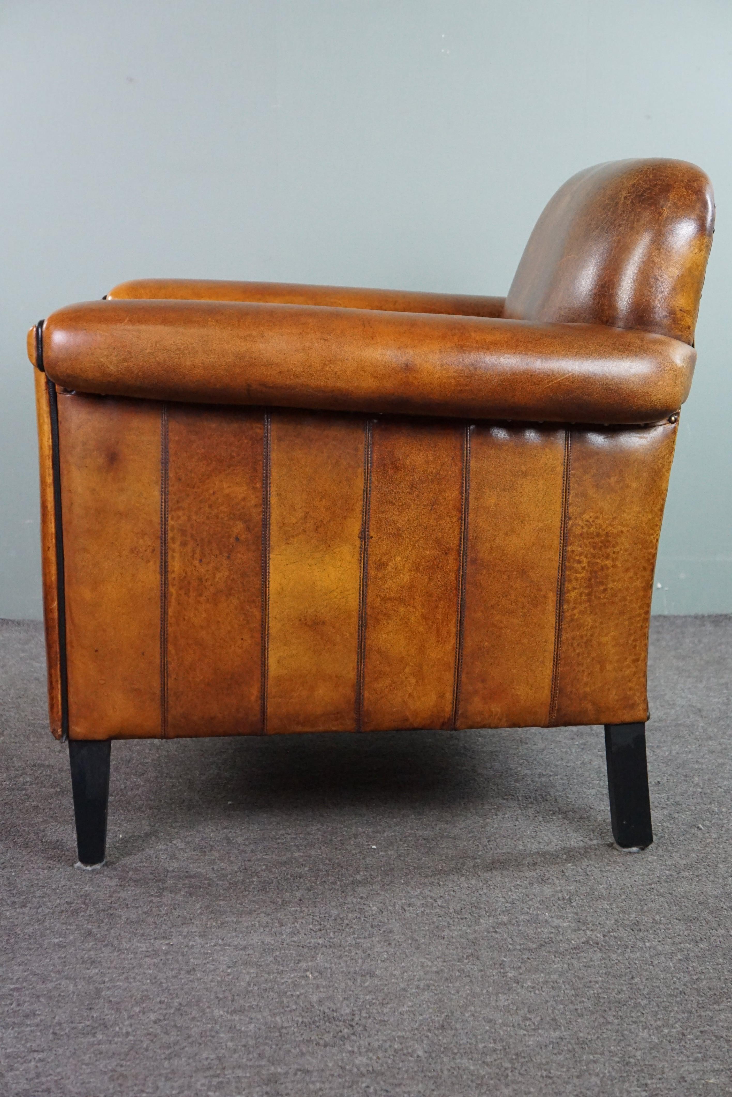 Leather Sheepskin Art Deco design armchair with accents all around For Sale