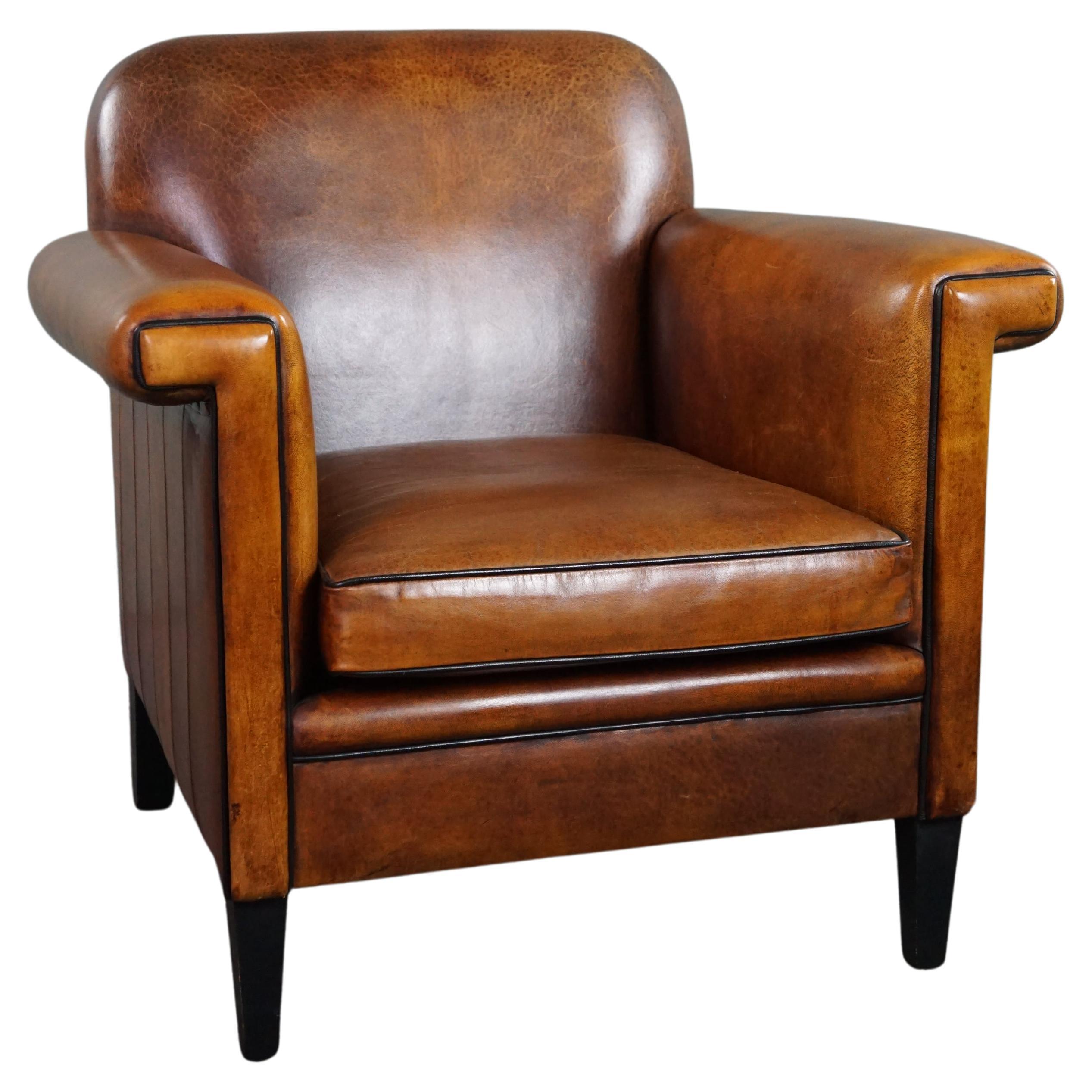Sheepskin Art Deco design armchair with accents all around For Sale