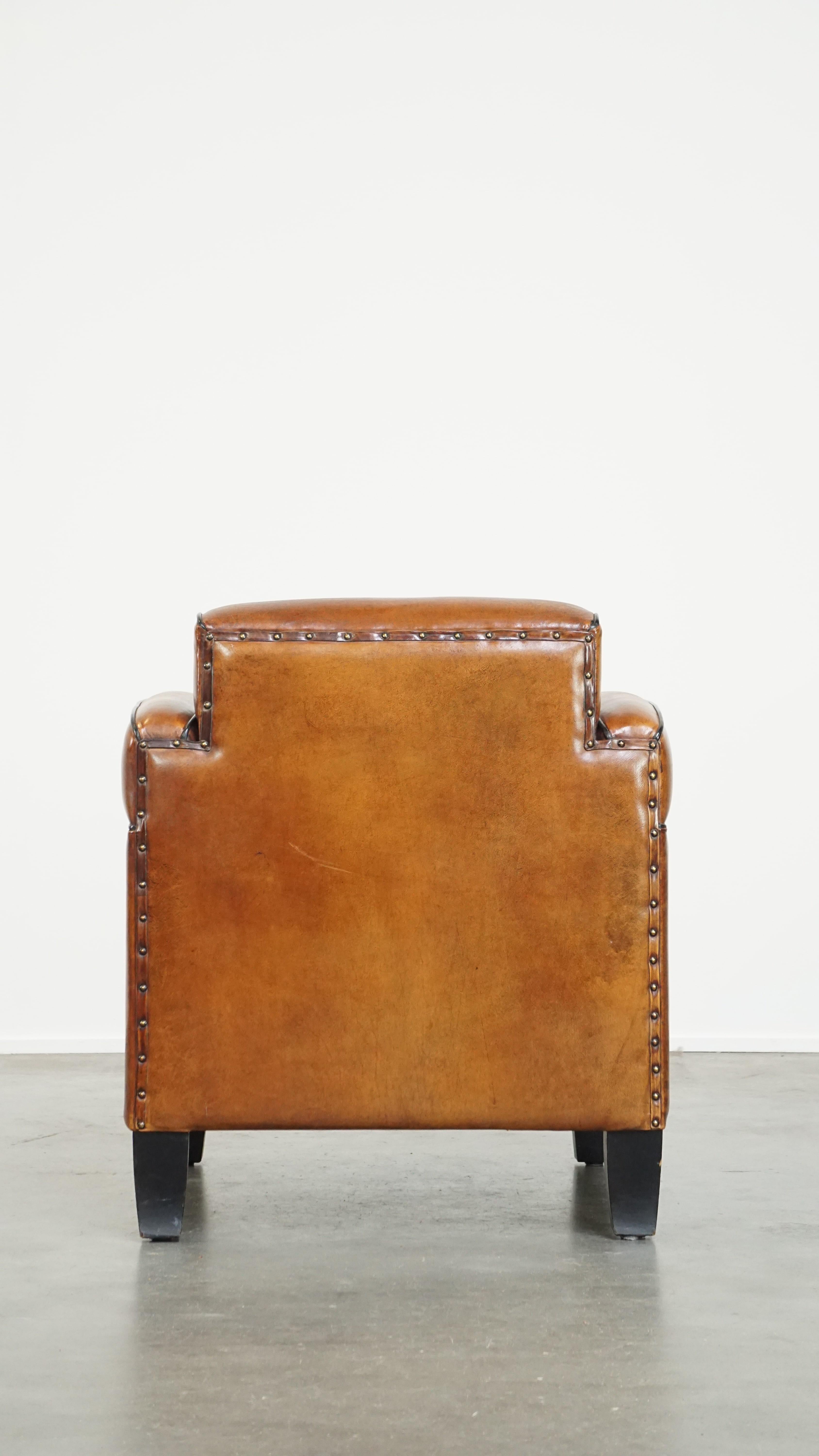 Sheepskin Art Deco design armchair with gorgeous wooden details and black piping In Good Condition For Sale In Harderwijk, NL