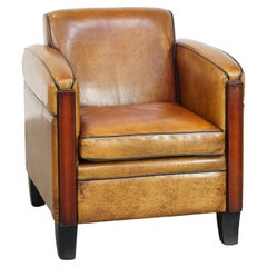 Sheepskin Art Deco design armchair with gorgeous wooden details and black piping