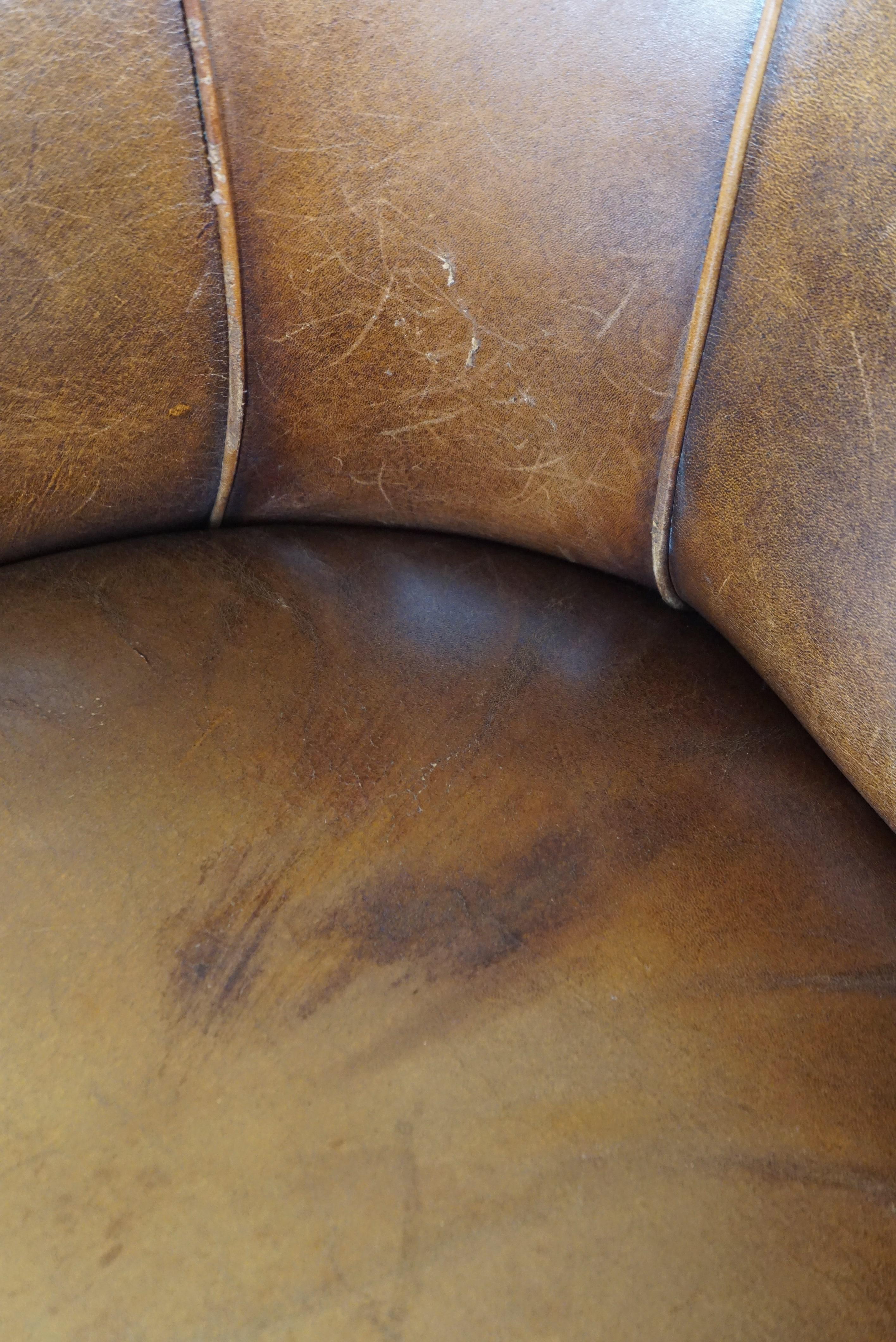 Late 20th Century Sheepskin club armchair with a fixed seat cushion For Sale