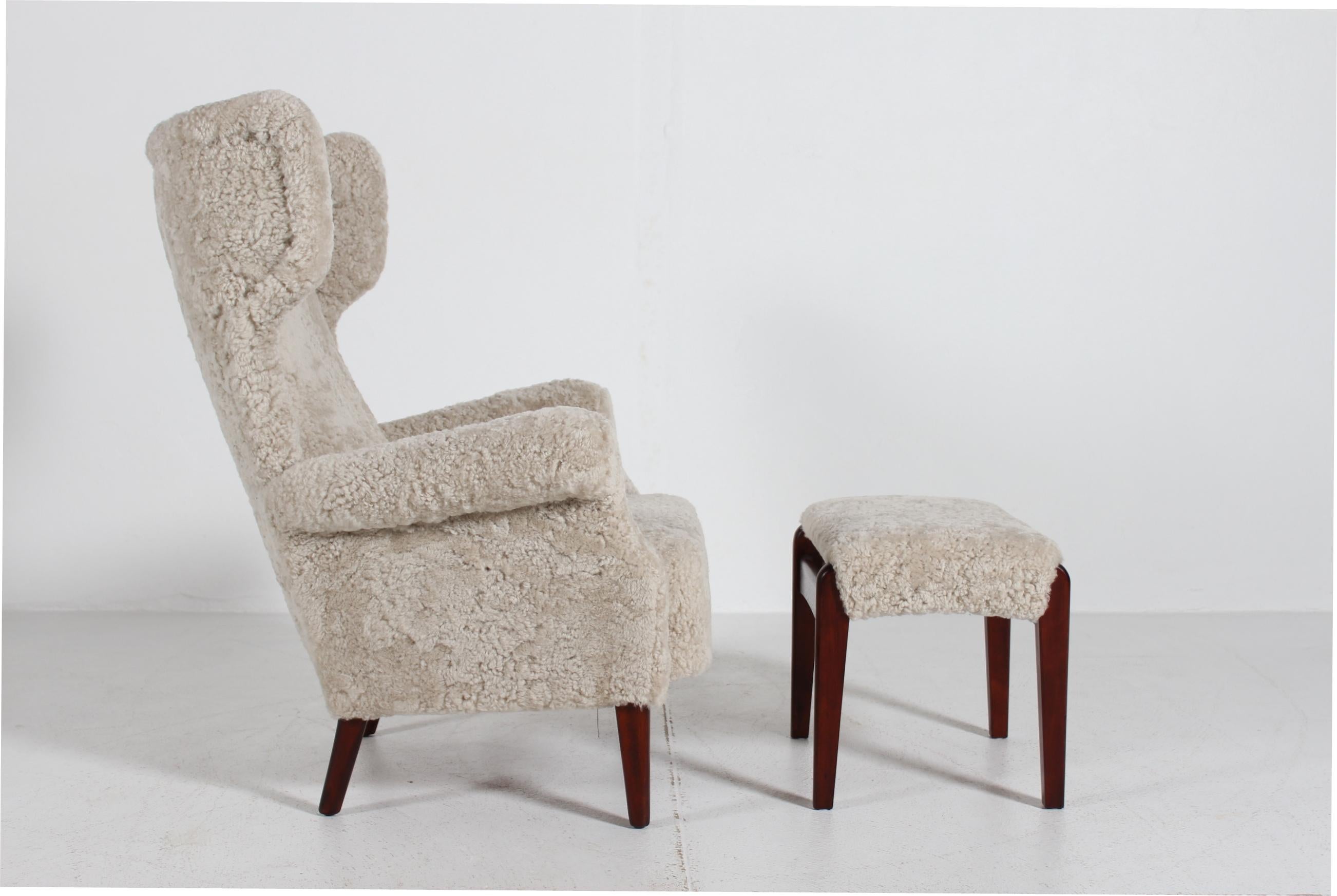 Danish Sheepskin Fritz Hansen Wingback Lounge Chair model FH 8023 with Stool 1950 For Sale
