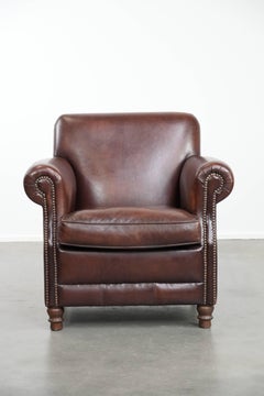 Sheepskin leather armchair a classic finish with decorative nails
