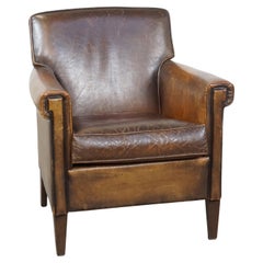 Vintage Sheepskin leather armchair with much character and a touch of Art Deco design