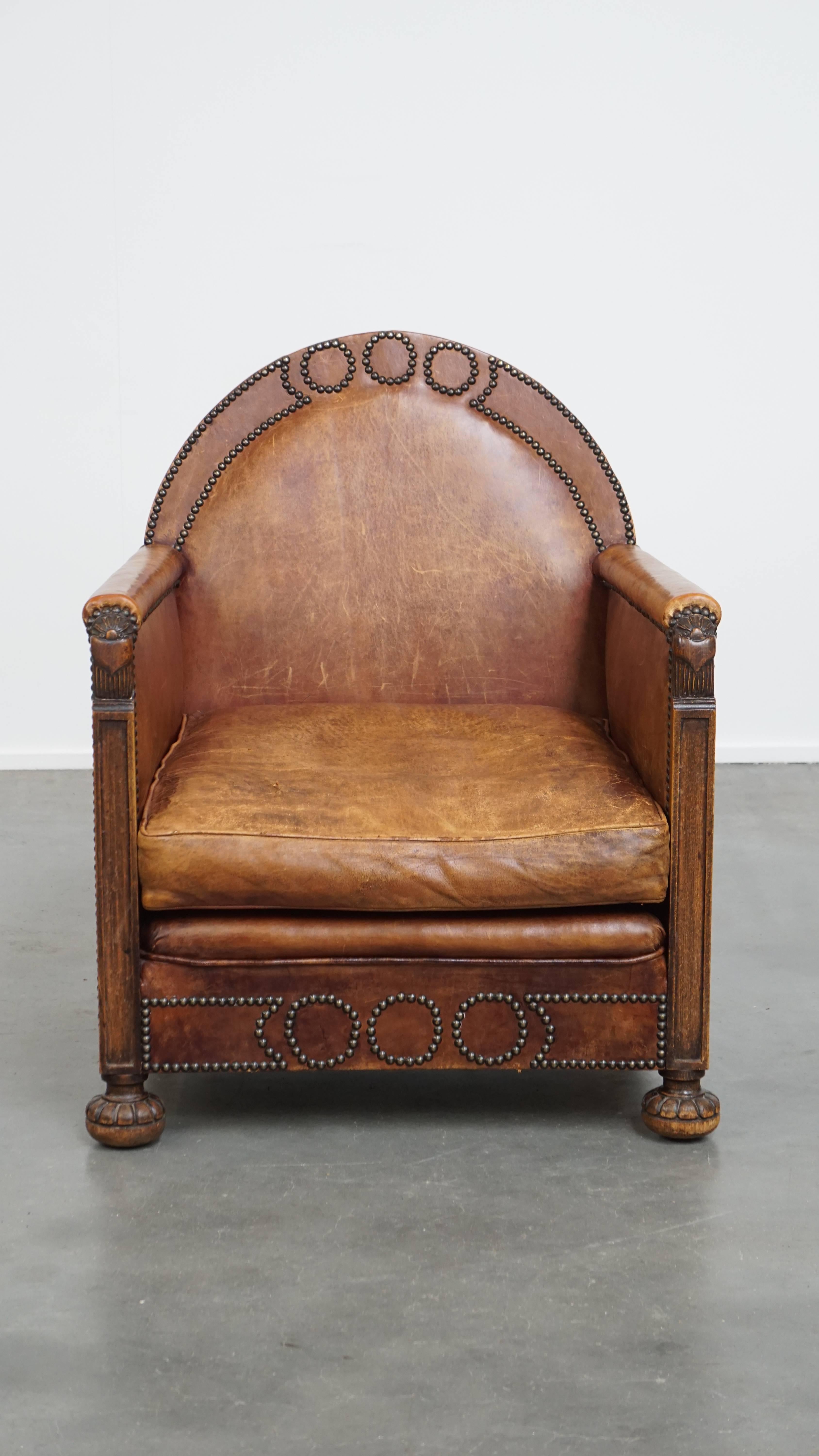 Offered here is this beautiful, vintage, characterful and unique luxury sheepskin leather Art Deco design armchair, full of remarkable details.

This one-of-a-kind Art Deco sheepskin leather armchair is bursting with unique features that make it an