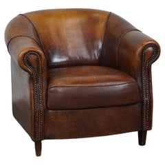 Used Sheepskin leather club armchair with beautiful colors and comfortable seating