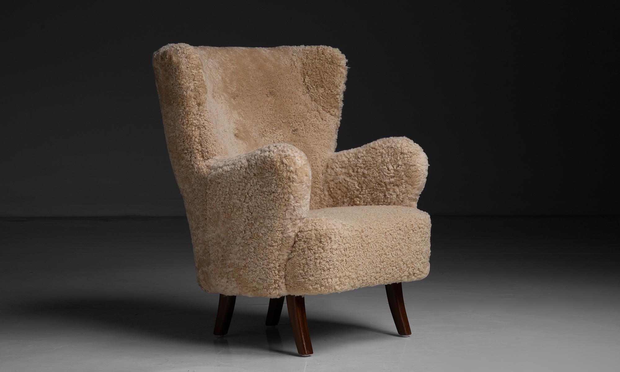 Shearling Chair by Alfred Christensen

Denmark circa 1950

High-back lounge chair recently reupholstered in natural honey colored sheepskin.

Measures 33”w x 29”d x 37”h x 18”seat