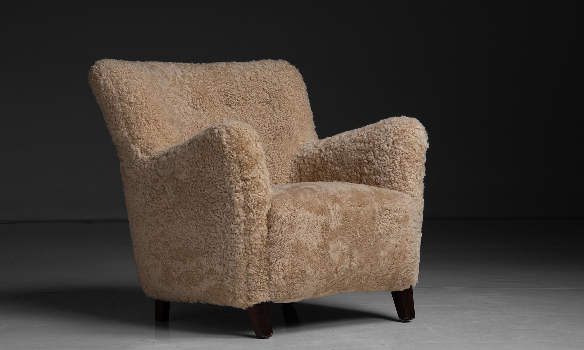 Shearling Lounge Chair

Denmark circa 1940

Button-back lounge chair from a Danish cabinet maker, recently reupholstered in natural honey colored sheepskin.

Measures 31”w x 33.5”d x 32”h x 17”seat