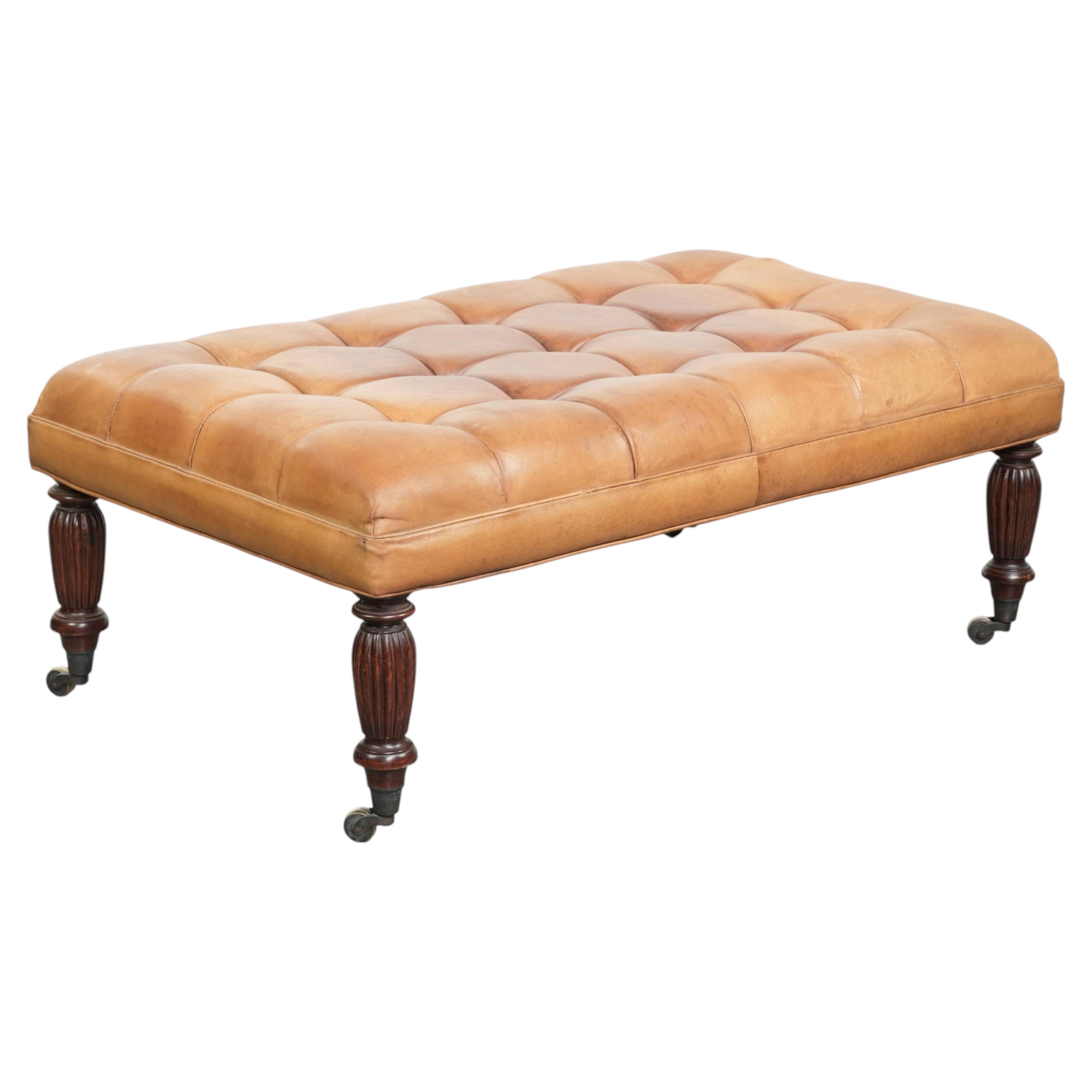 Sheepskin ottoman/coffee table on wheels in English chesterfield style