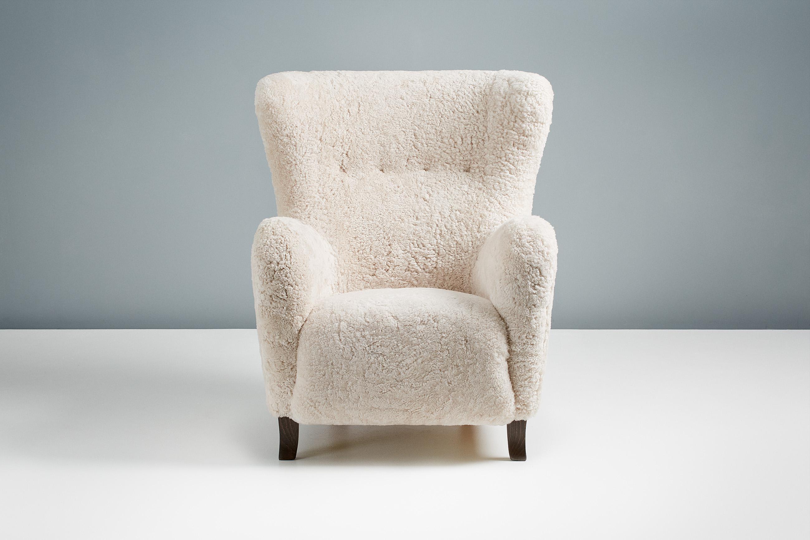 Dagmar - Sampo Wing Chair & Ottoman

A custom-made wing chair and ottoman developed & produced at our workshops in London using the highest quality materials. The frame is built from solid tulipwood with a fully sprung seat. The Sampo chair is
