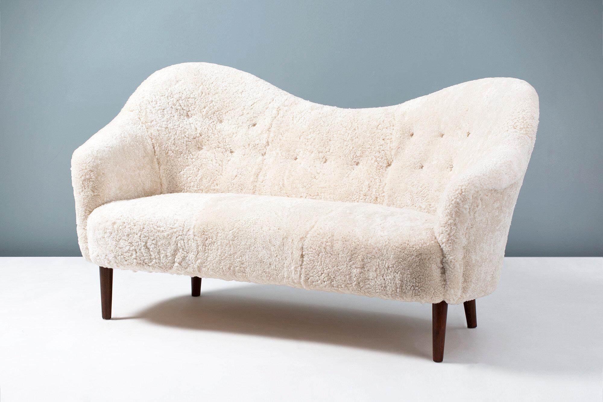 Carl Malmsten 'Samspel' sofa

This iconic piece of Swedish furniture was designed in 1956 by master cabinetmaker Carl Malmsten. It was produced by AB Record in Bollnas, Sweden. This example has been reupholstered in luxurious Australian shearling