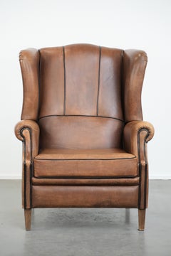 Sheepskin wingback armchair with beautiful colours in good condition