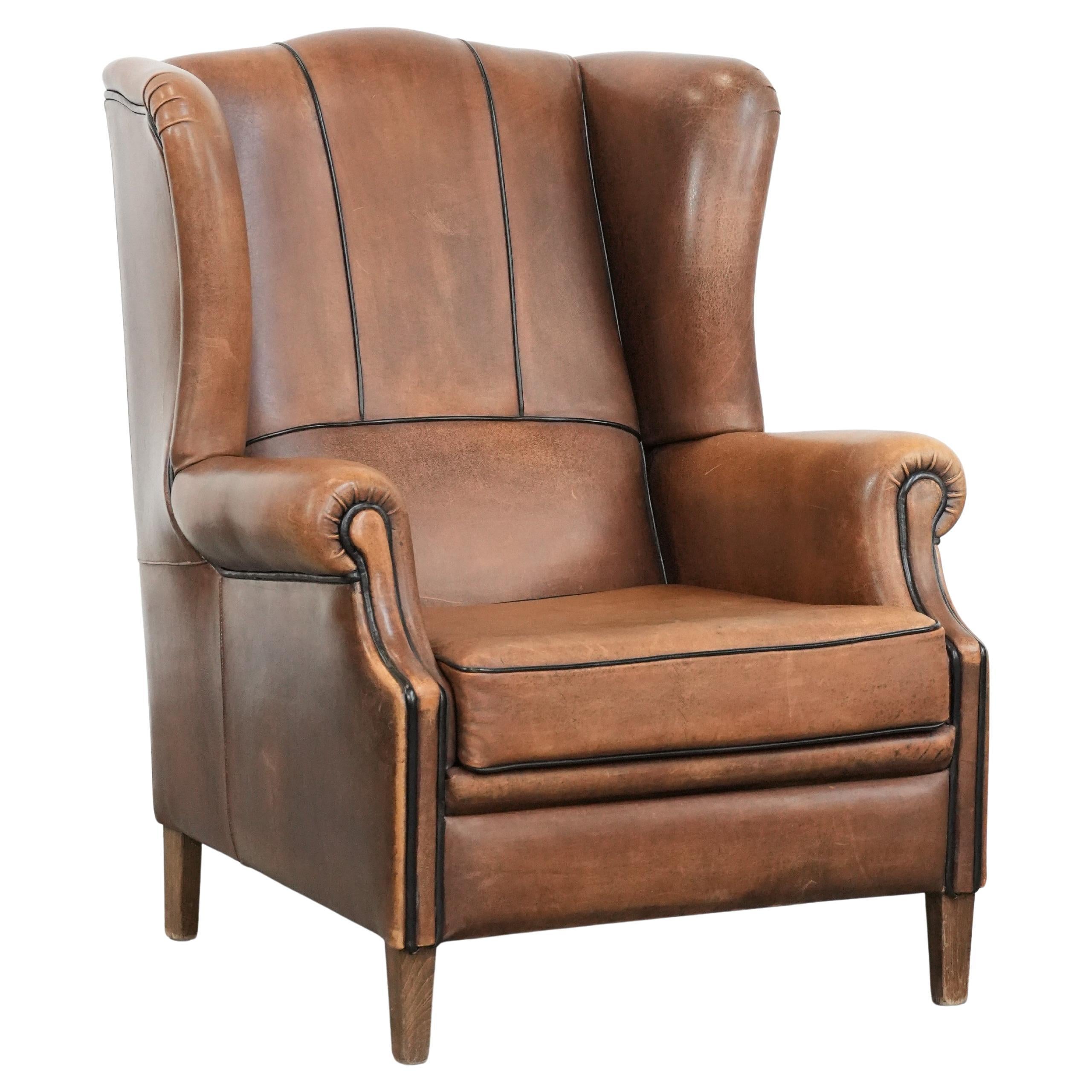 Sheepskin wingback armchair with beautiful colours in good condition