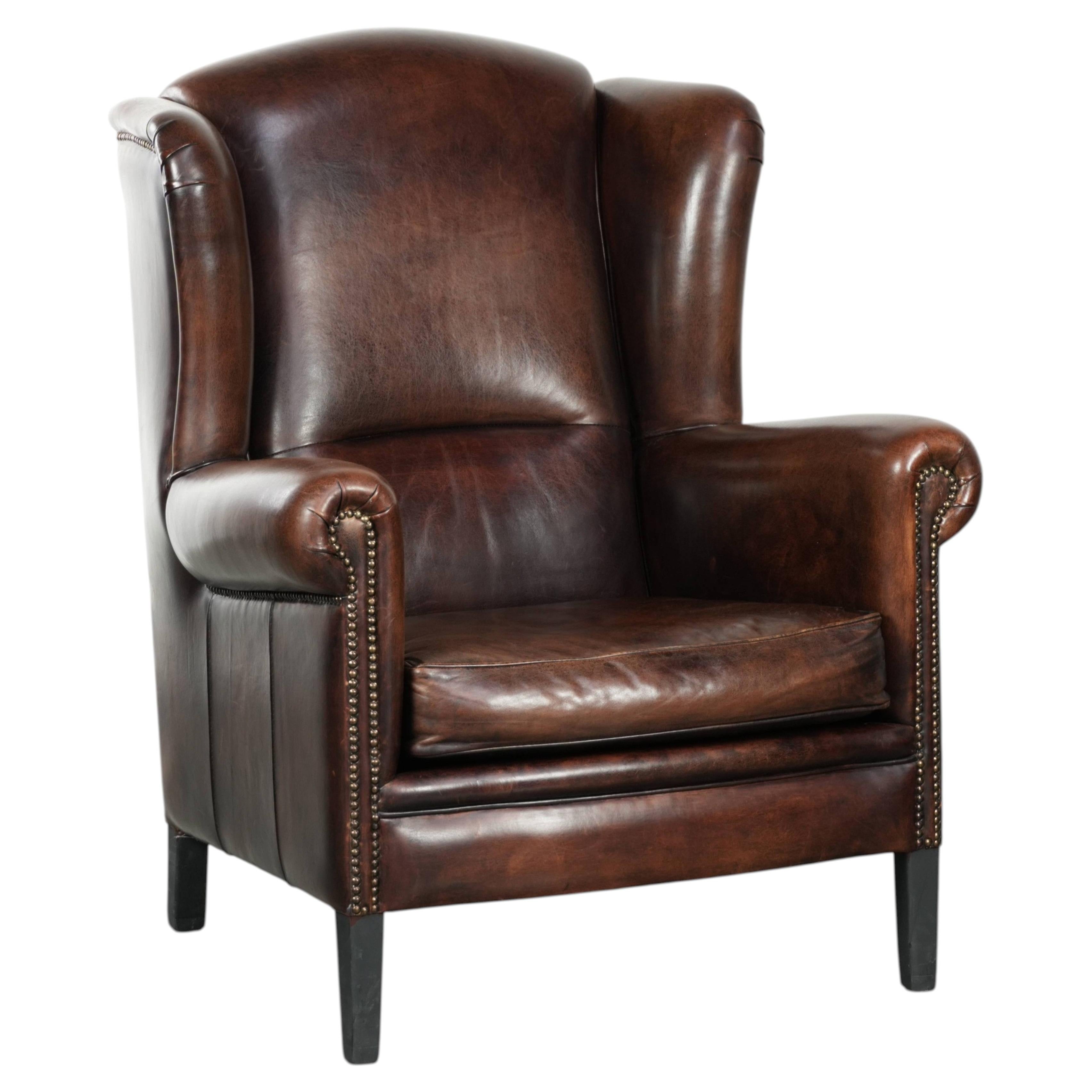 Sheepskin wingback armchair with beautiful deep and warm colours For Sale