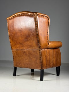 Sedia wingback in pelle di pecora