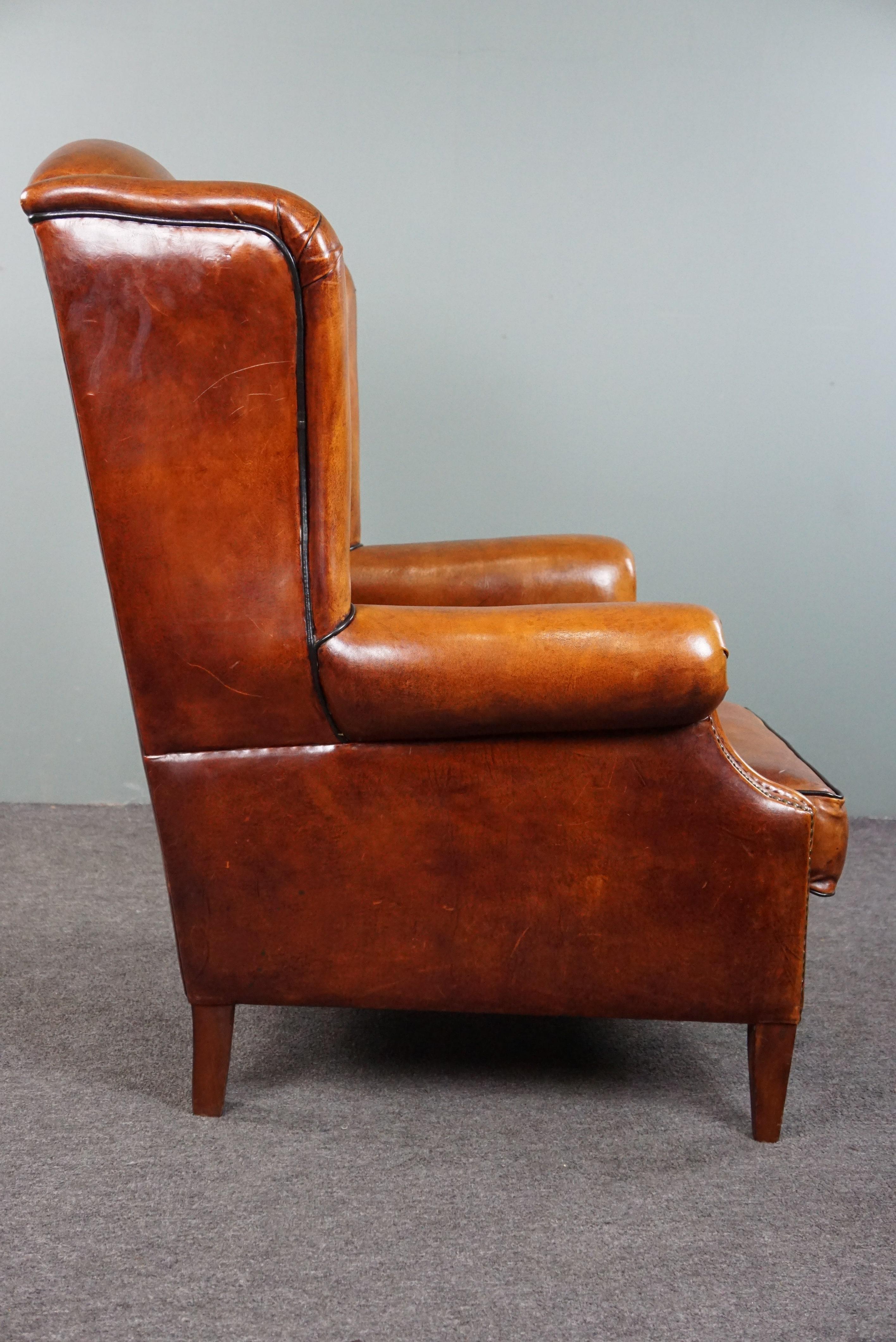 Sheepskin wingback chair with black piping In Good Condition For Sale In Harderwijk, NL