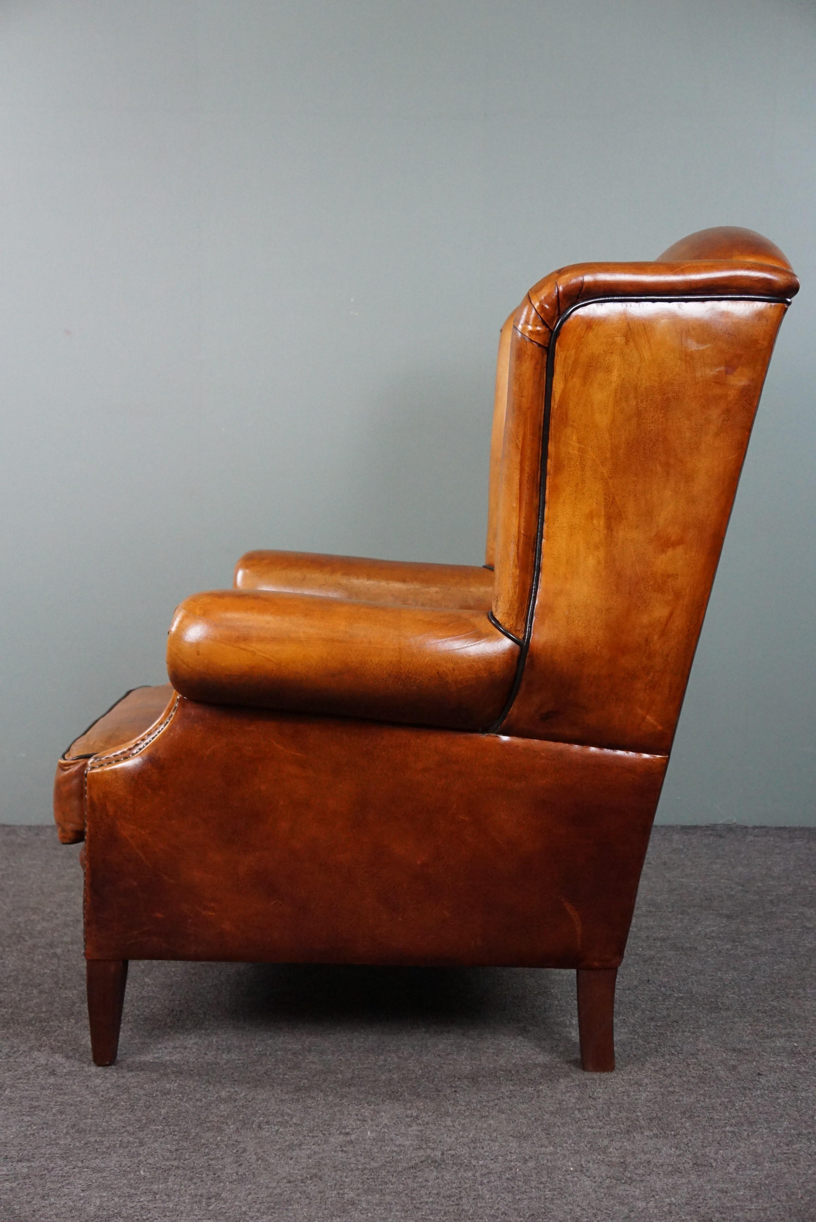 Leather Sheepskin wingback chair with black piping For Sale