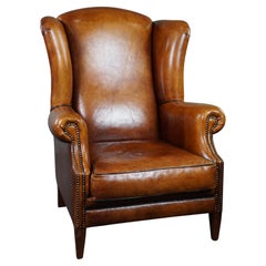 Sheepskin wingback chair with black piping