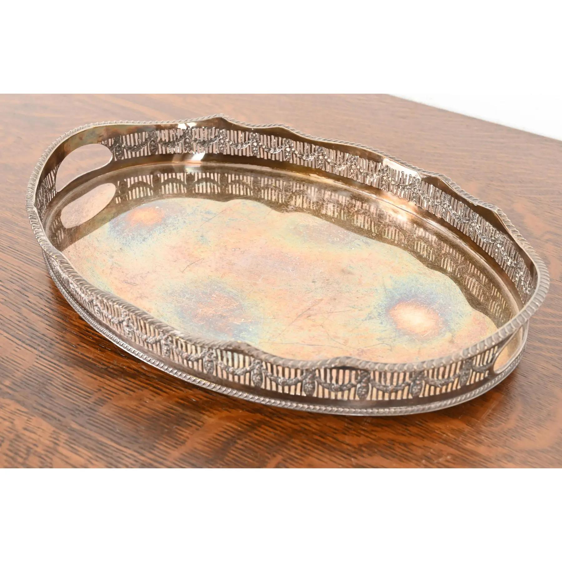 A gorgeous English silver plate handled and footed reticulated serving tray

By Sheffield

England, Circa Early 20th Century

Measures: 16.25