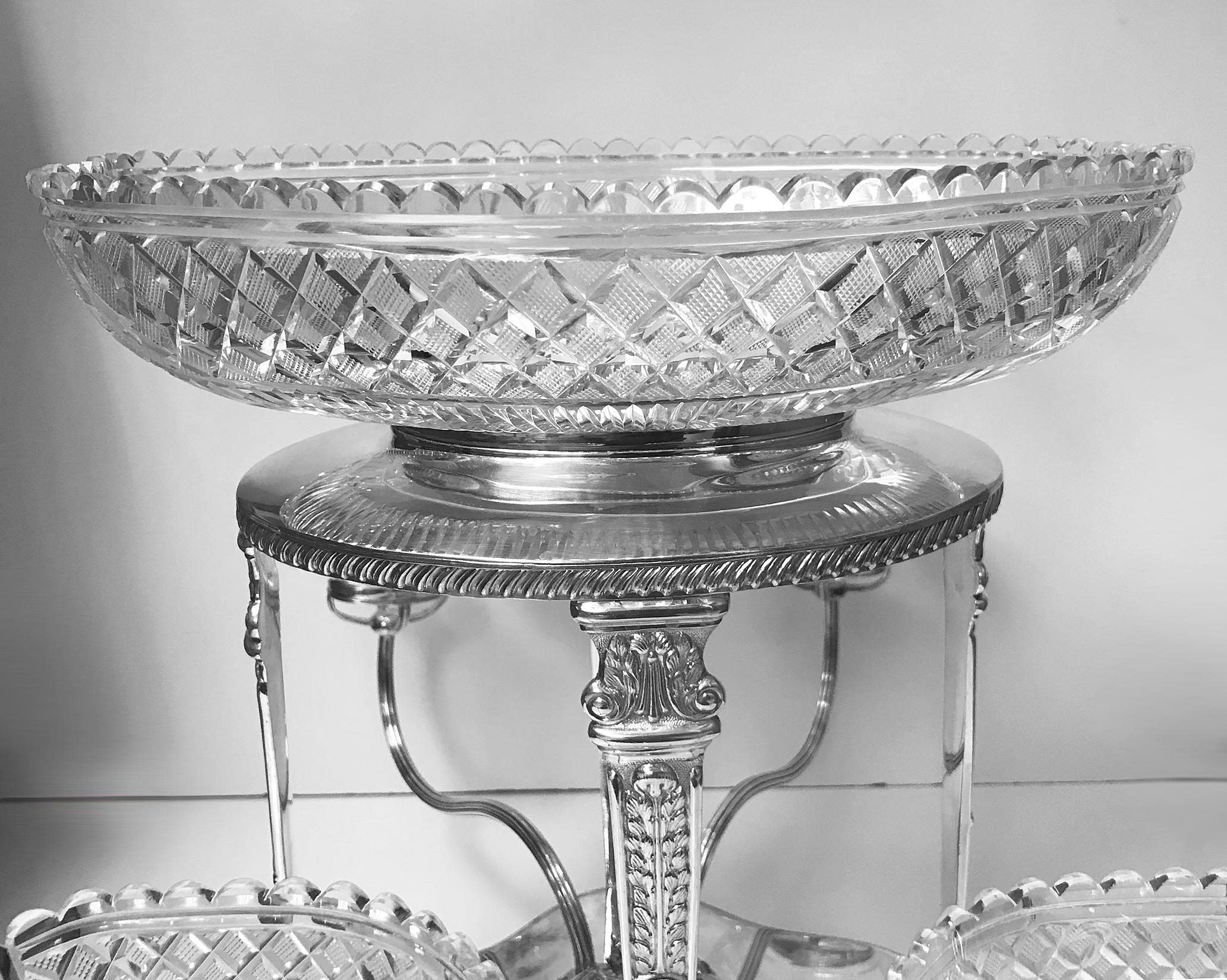 Sheffield plate epergne, English, circa 1890.The rectangular stand on 4 foliage shell knuckle supports, lobate gadroon rim, base and central section of lobate acanthus design and central Stand supporting a large oval cut glass diamond lozenge